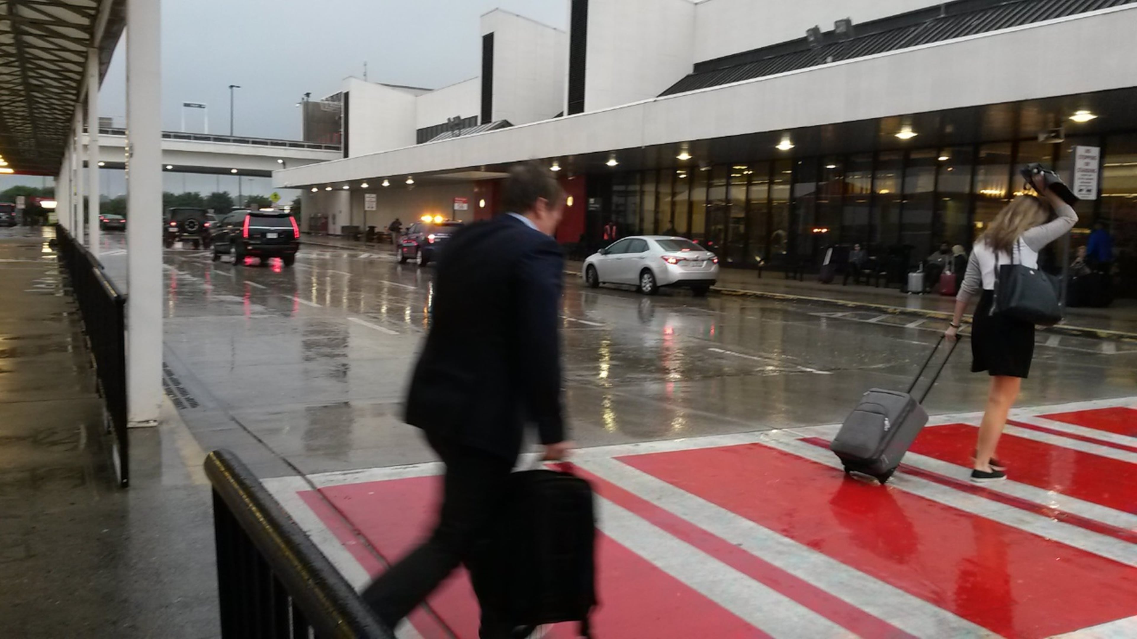 Passengers aren’t under cover for most of the crossing between parking decks and the domestic terminal at Hartsfield-Jackson Atlanta International Airport. MATT KEMPNER / AJC