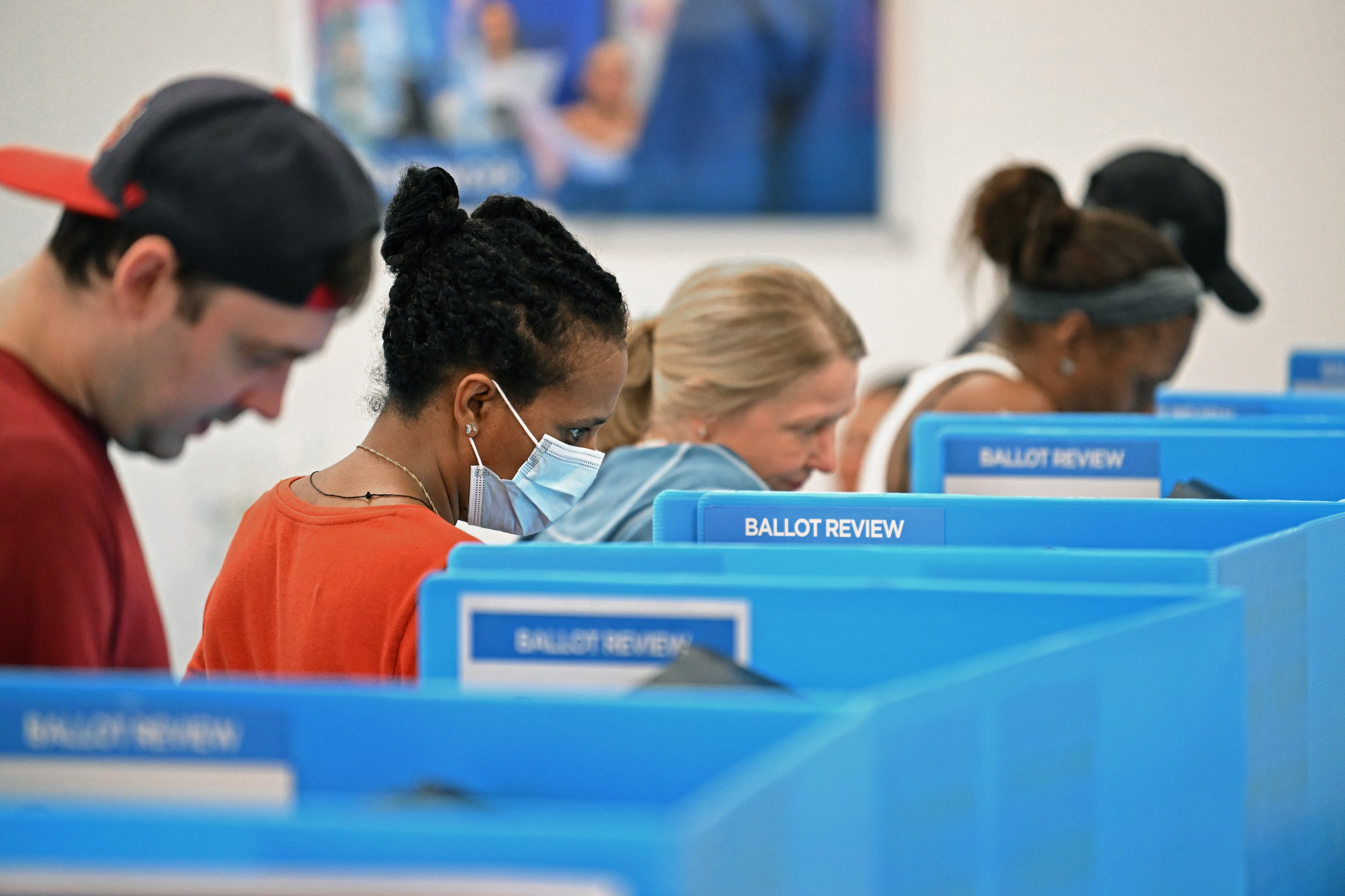 Voters cast their ballots during early in-person voting at the Gwinnett County Voter Registrations and Elections office in Lawrenceville on Wednesday, Oct. 30, 2024, in Lawrenceville. (Hyosub Shin/AJC)