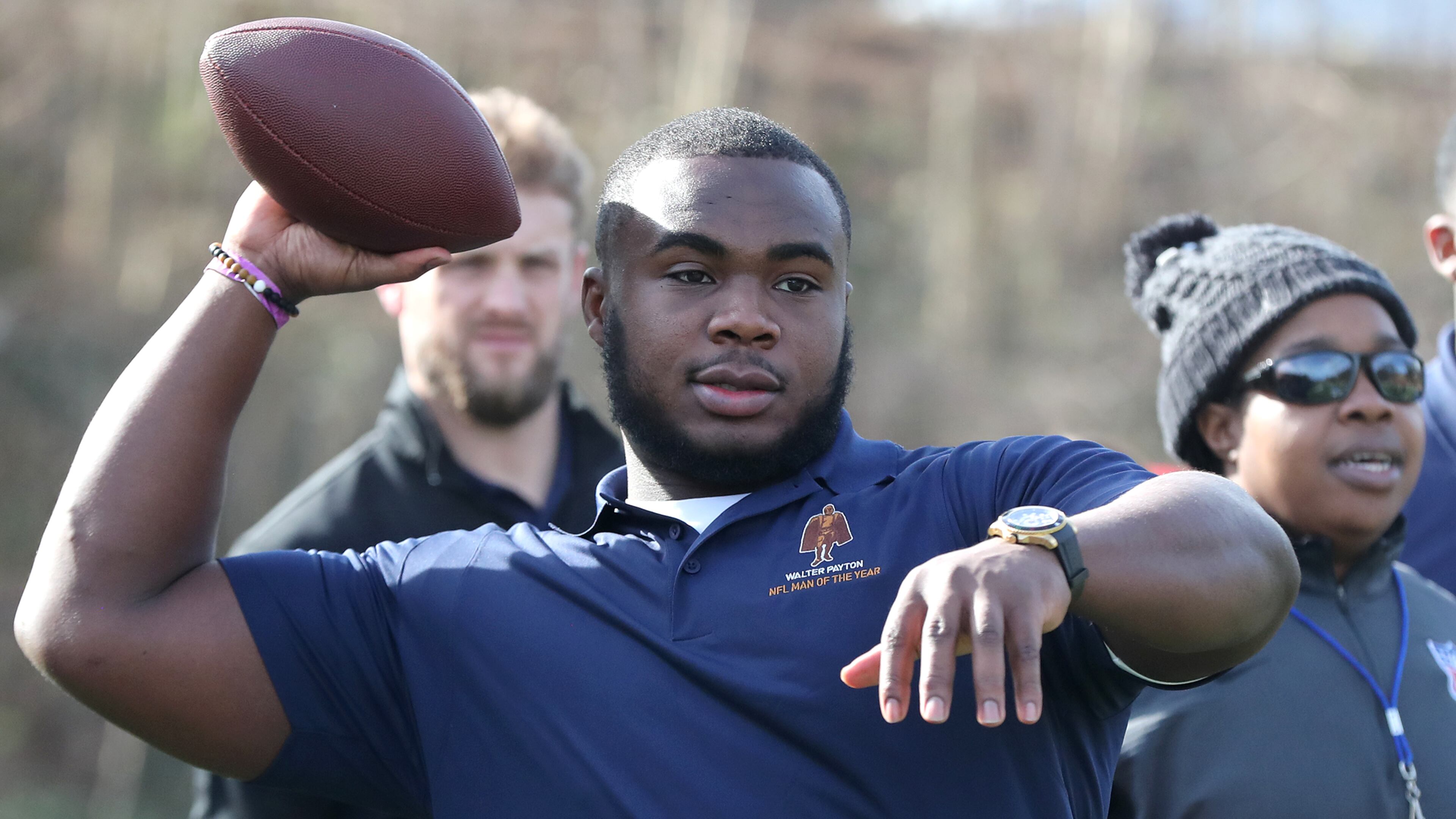 Atlanta- Atlanta Falcons defensive tackle Grady Jarrett throws a pass to students during the Walter Payton NFL Man of the Year Community Event at the Warren Boys & Girls Club on Friday, Feb. 1, 2019, in Atlanta. Considered the league's most prestigious honor, nominated players participated in activities, beautification projects, and building a new playground. Curtis Compton/ccompton@ajc.com