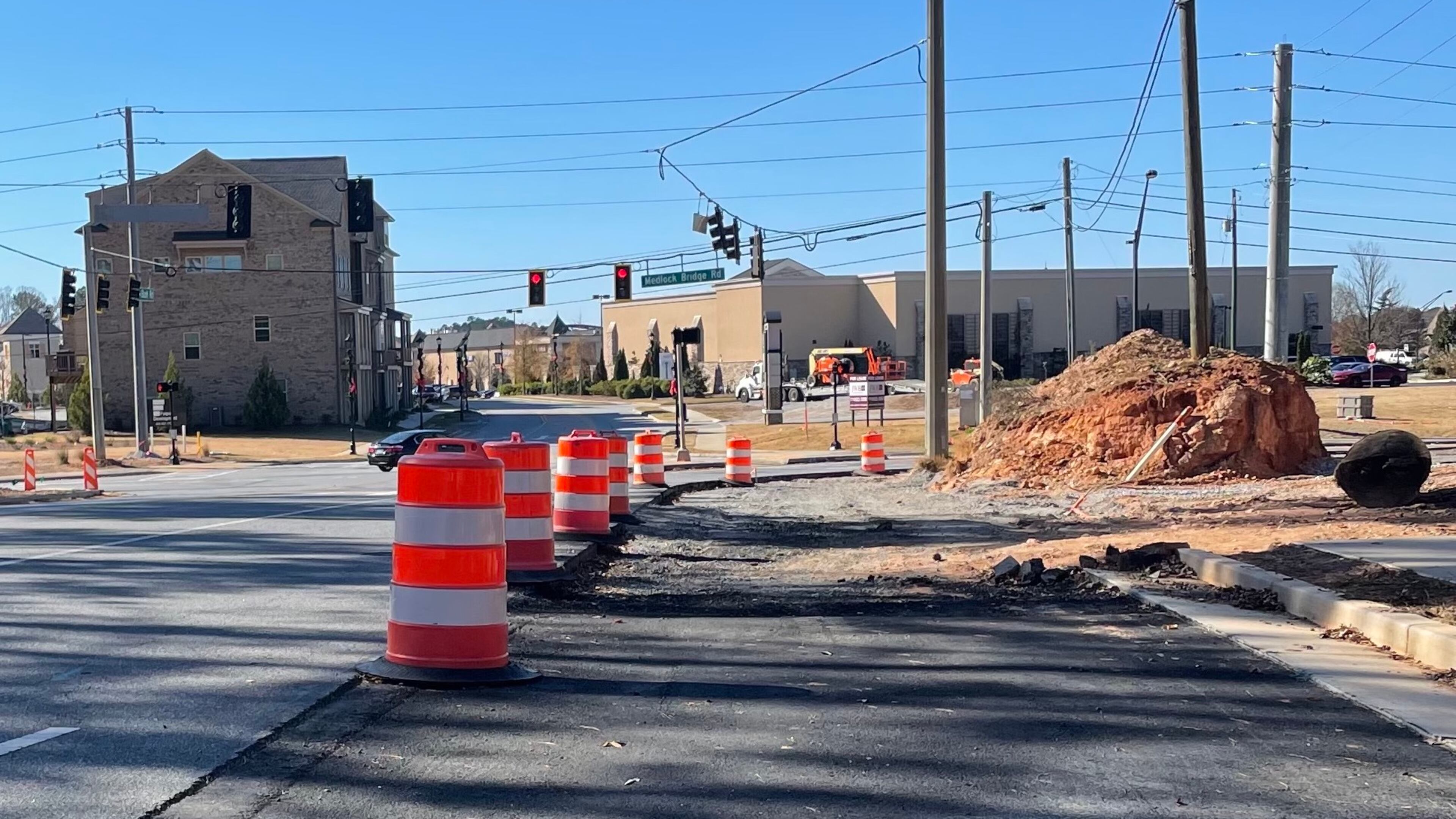 Work continues on intersection improvements at Bush Road and Medlock Bridge Road in Peachtree Corners. (Photo by Karen Huppertz for the AJC)