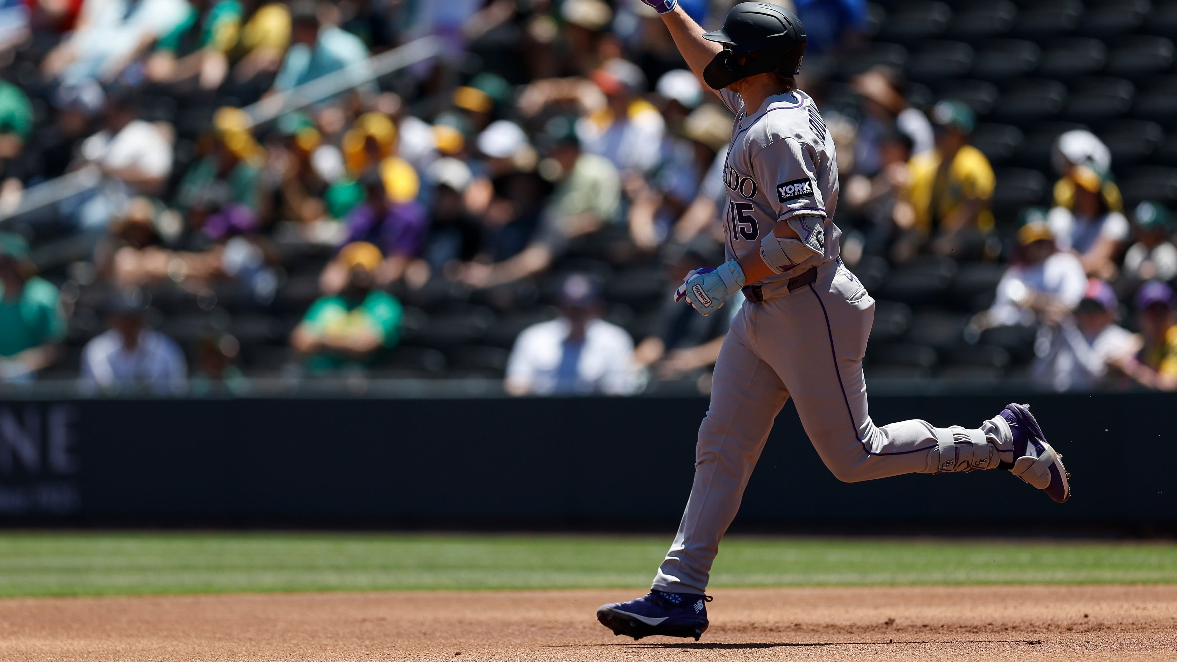Colorado Rockies' Hunter Goodman rounds the bases after hitting a two-run home run during the first inning of a baseball game against the Athletics, Sunday, June 14, 2026, in Las Vegas. (AP Photo/Caroline Brehman)