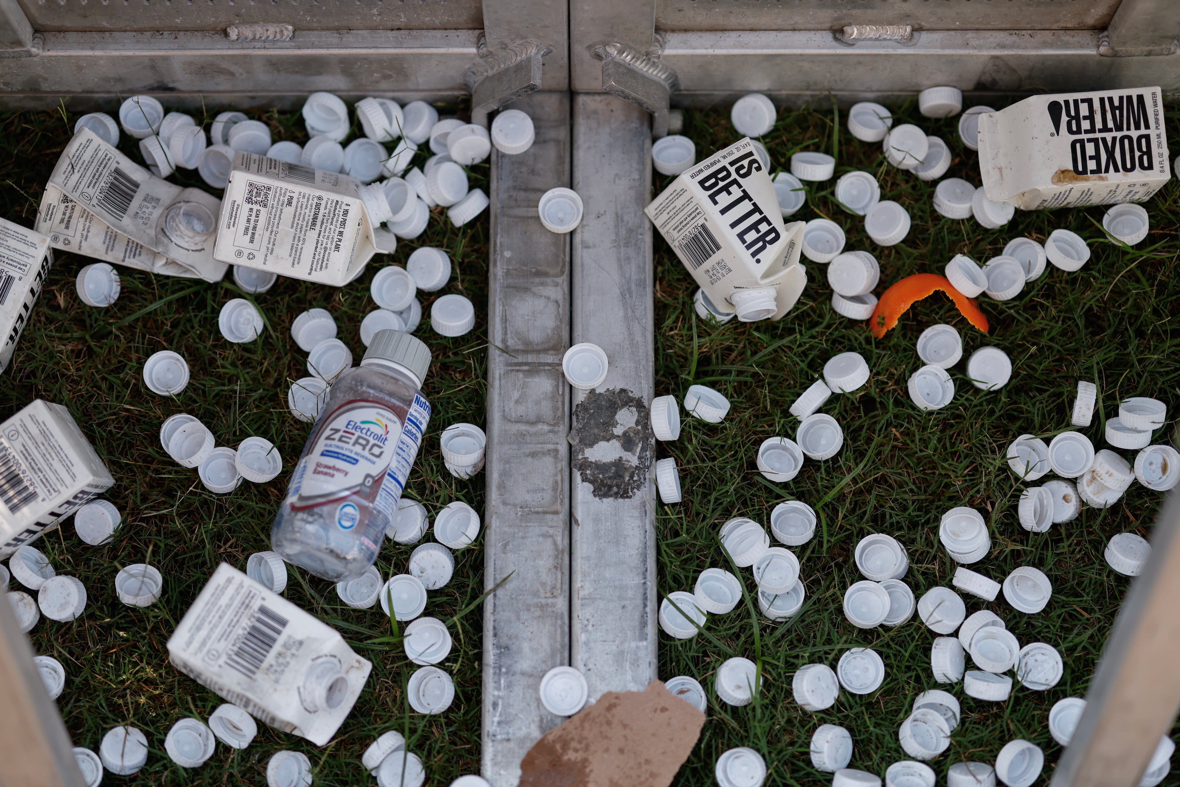 Discarded water cartons given to festivalgoers during the Shaky Knees music festival at Piedmont Park, Saturday, Sept. 19, 2026, in Atlanta. (Erik S. Lesser for the AJC)