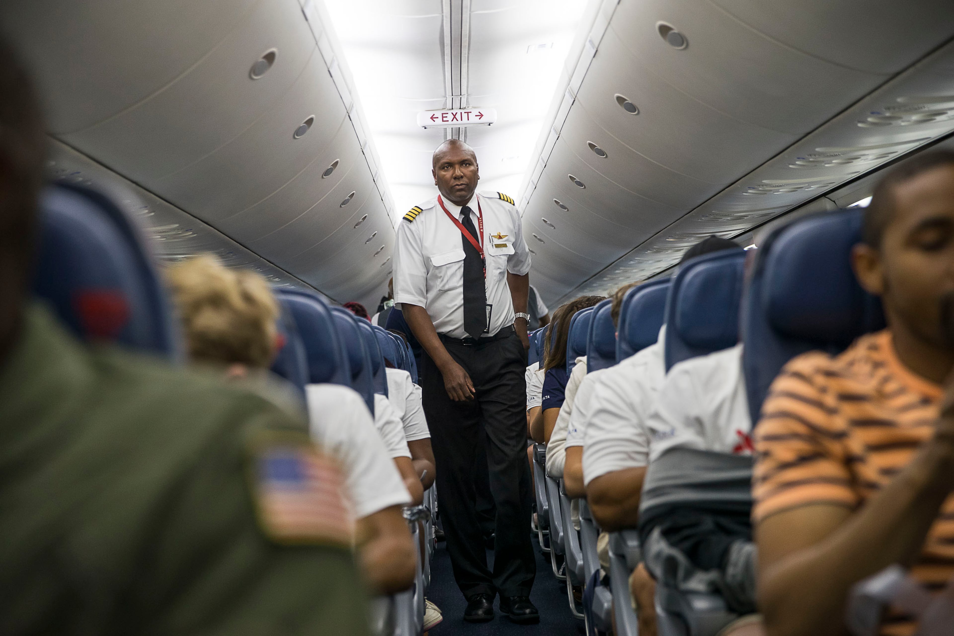 7/16/2019 -- Atlanta, Georgia -- Delta Air Lines pilot Capt. Guy Stallworth prepares to return to the cockpit after speaking with students aboard a chartered Delta airplane at Hartsfield-Jakcson International airport, Tuesday, July 16, 2019. (Alyssa Pointer/alyssa.pointer@ajc.com)