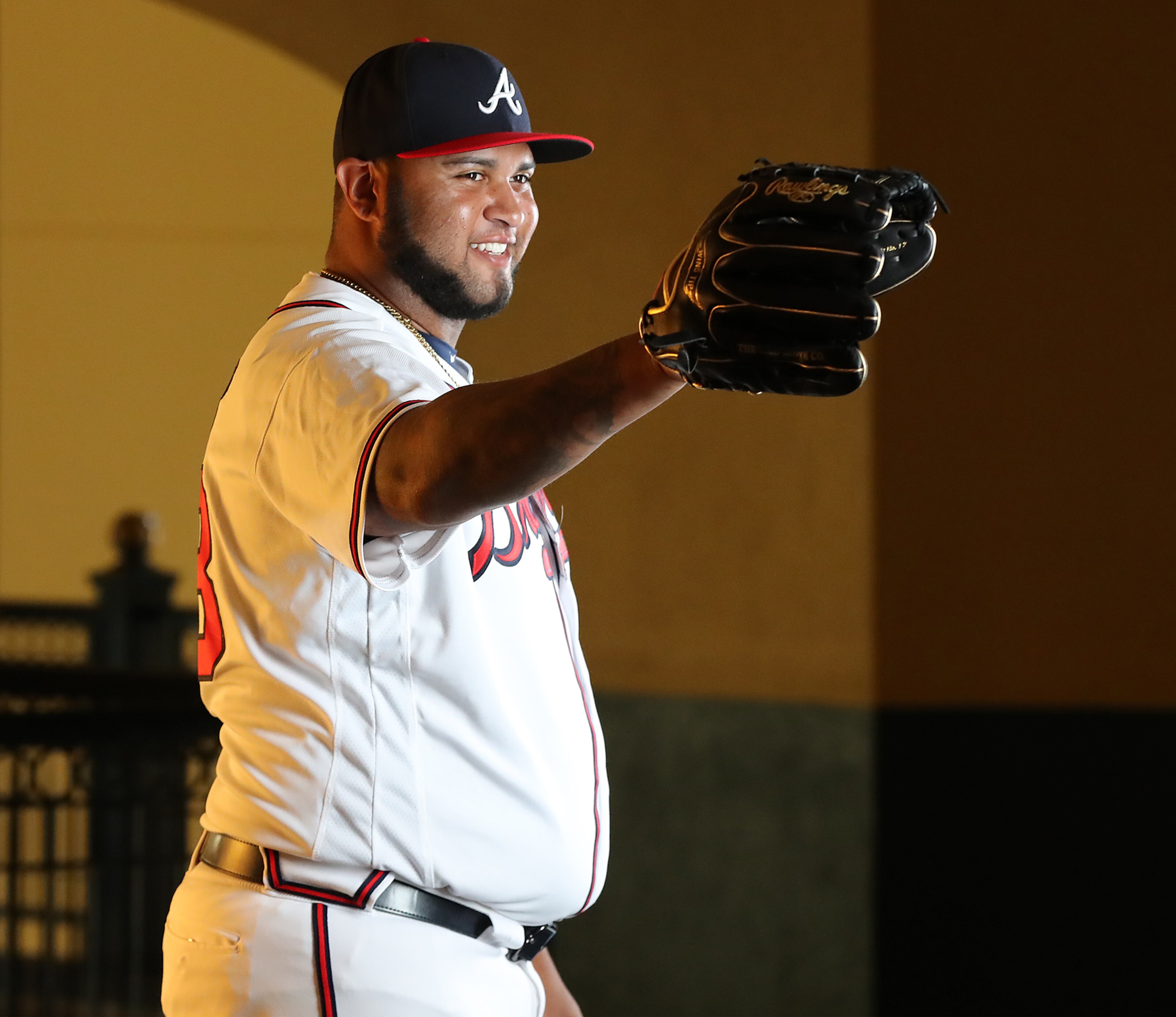 Luiz Gohara reacts to a teammate ribbing him while he has his picture taken on team photo day. Curtis Compton/ccompton@ajc.com