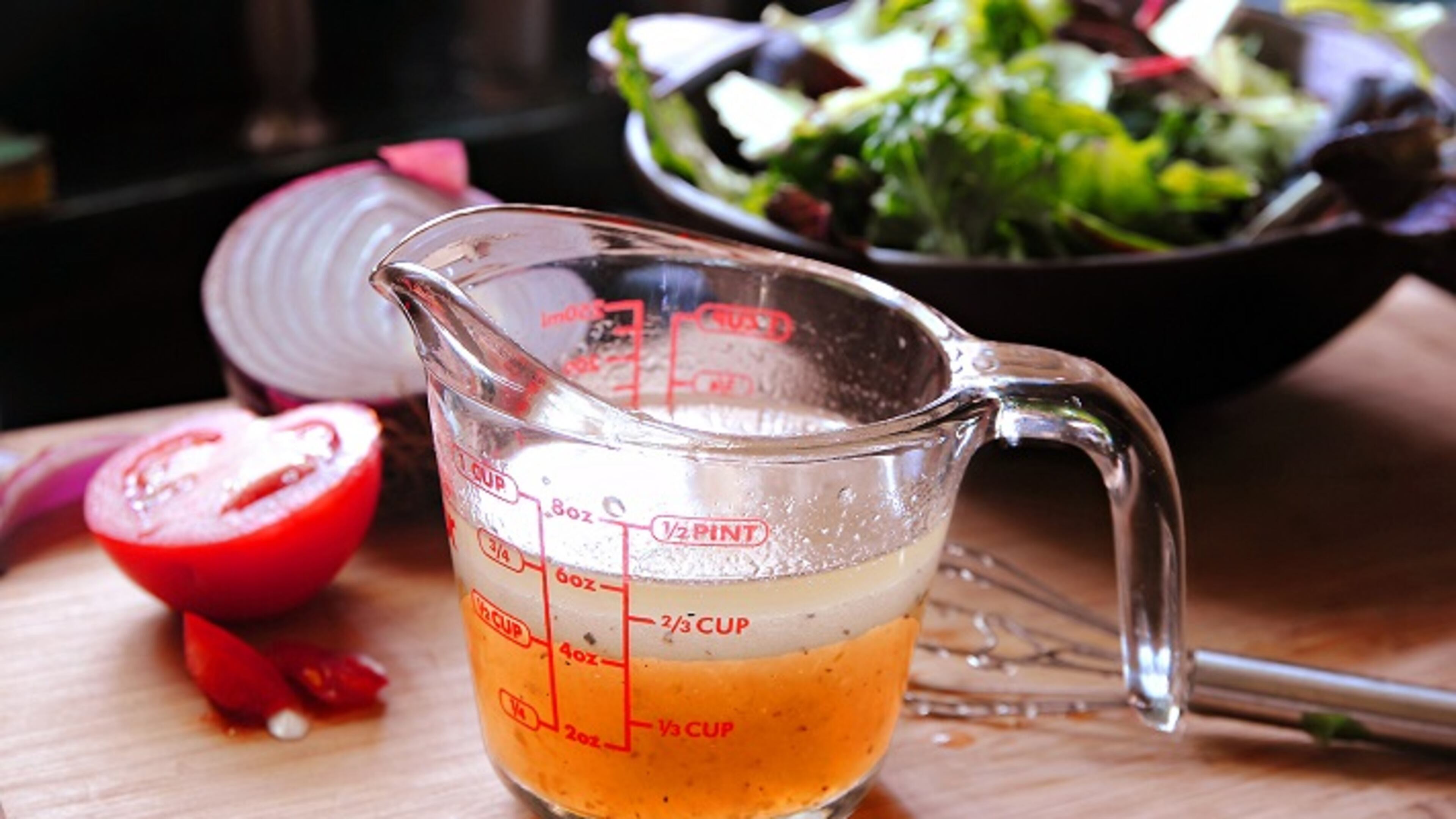 The right blend of oil, vinegar and spices can elevate a simple bowl of greens, including this Pepper Jelly Vinaigrette. (Gretchen McKay/Pittsburgh Post-Gazette/TNS)
