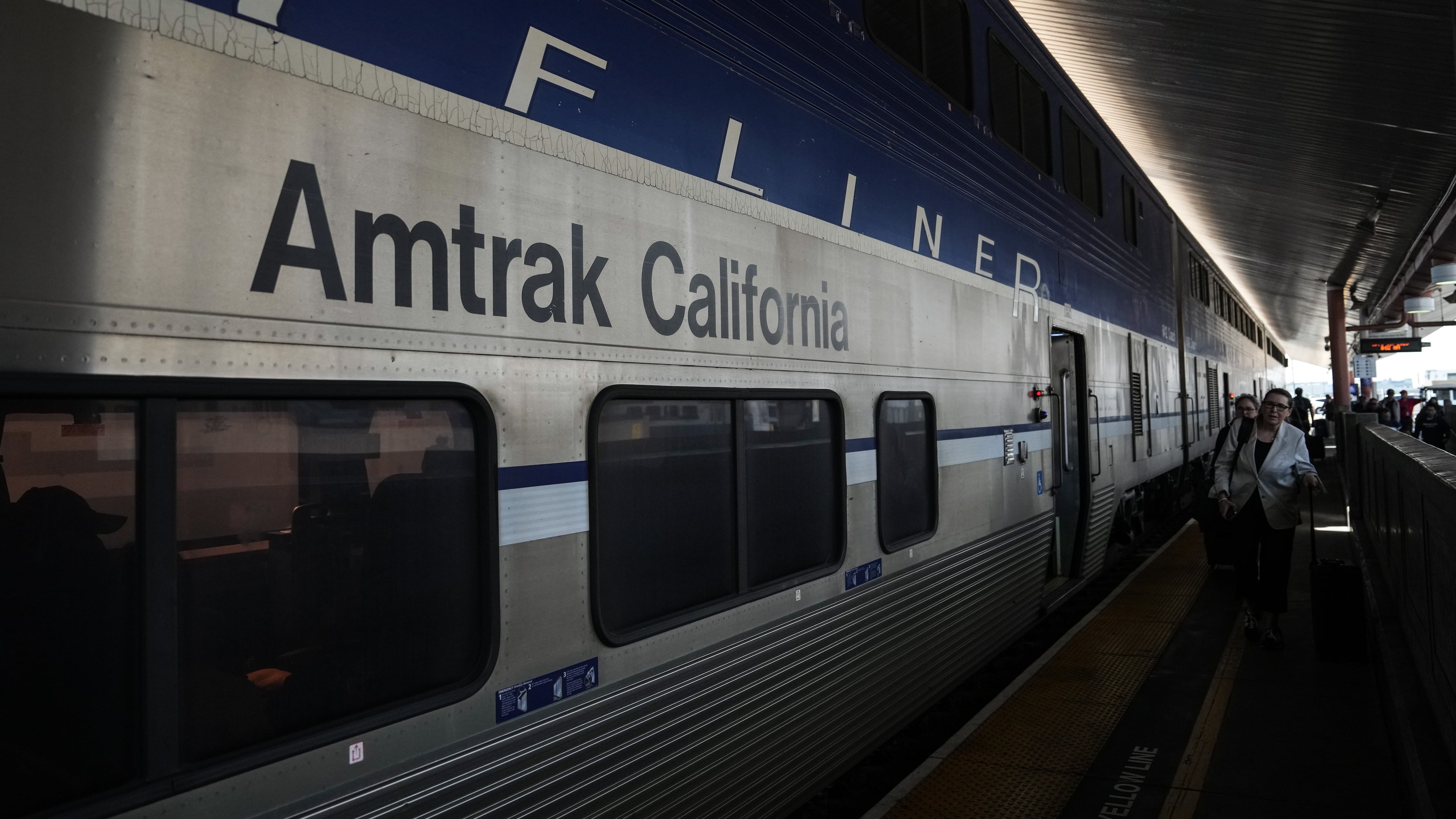 Passengers deboard an Amtrak train at Union Station in Los Angeles, Thursday, April 30, 2026. (AP Photo/Jae C. Hong)