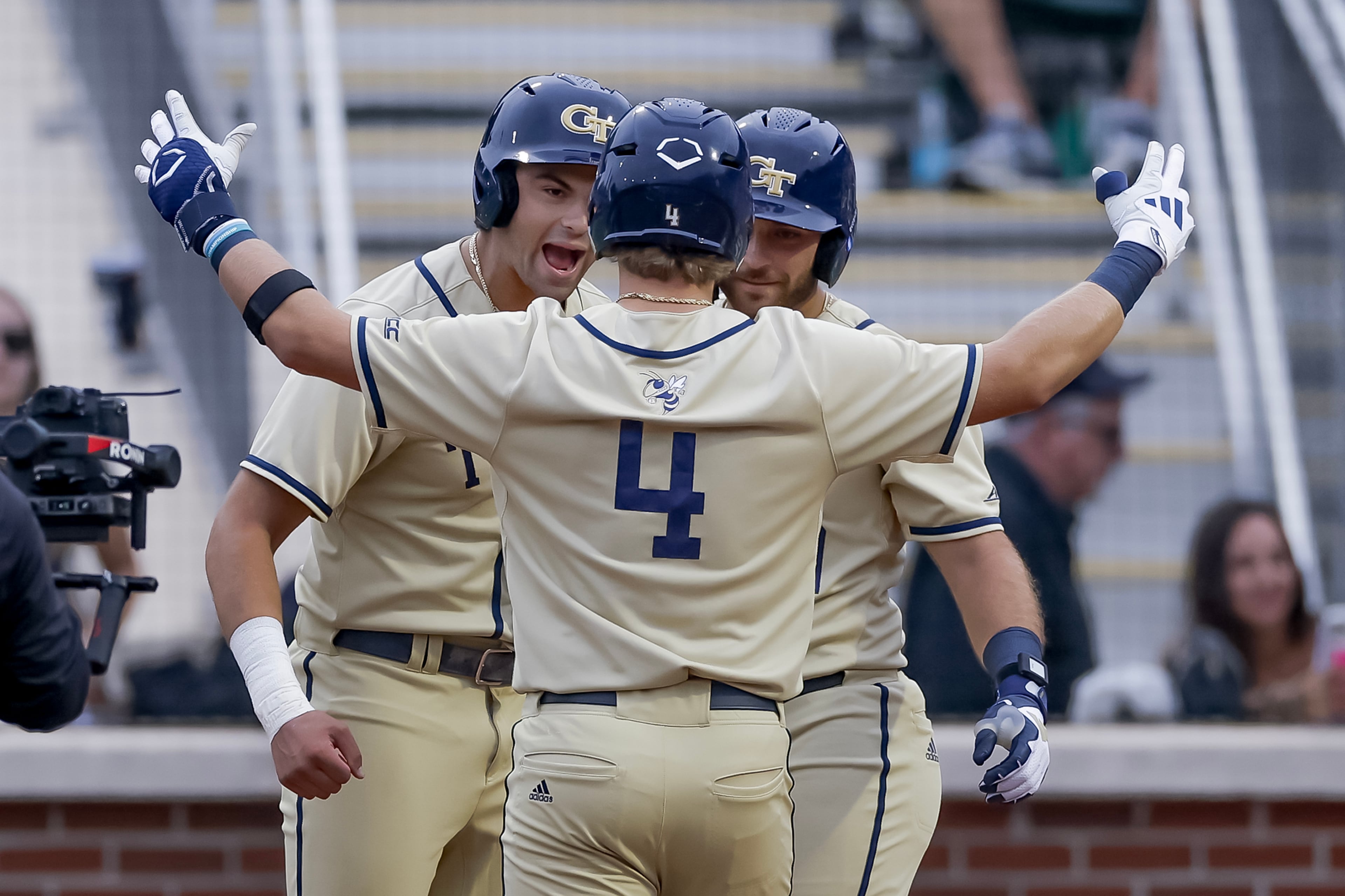 Georgia Tech's Alex Hernandez (center) celebrates with Ryan Zuckerman (left) and Kent Schmidt after hitting a two-run home run against Oklahoma during the third inning of the Atlanta Regional game at Russ Chandler Stadium, Sunday, May 31, 2026, in Atlanta. (Erik S. Lesser for the AJC)