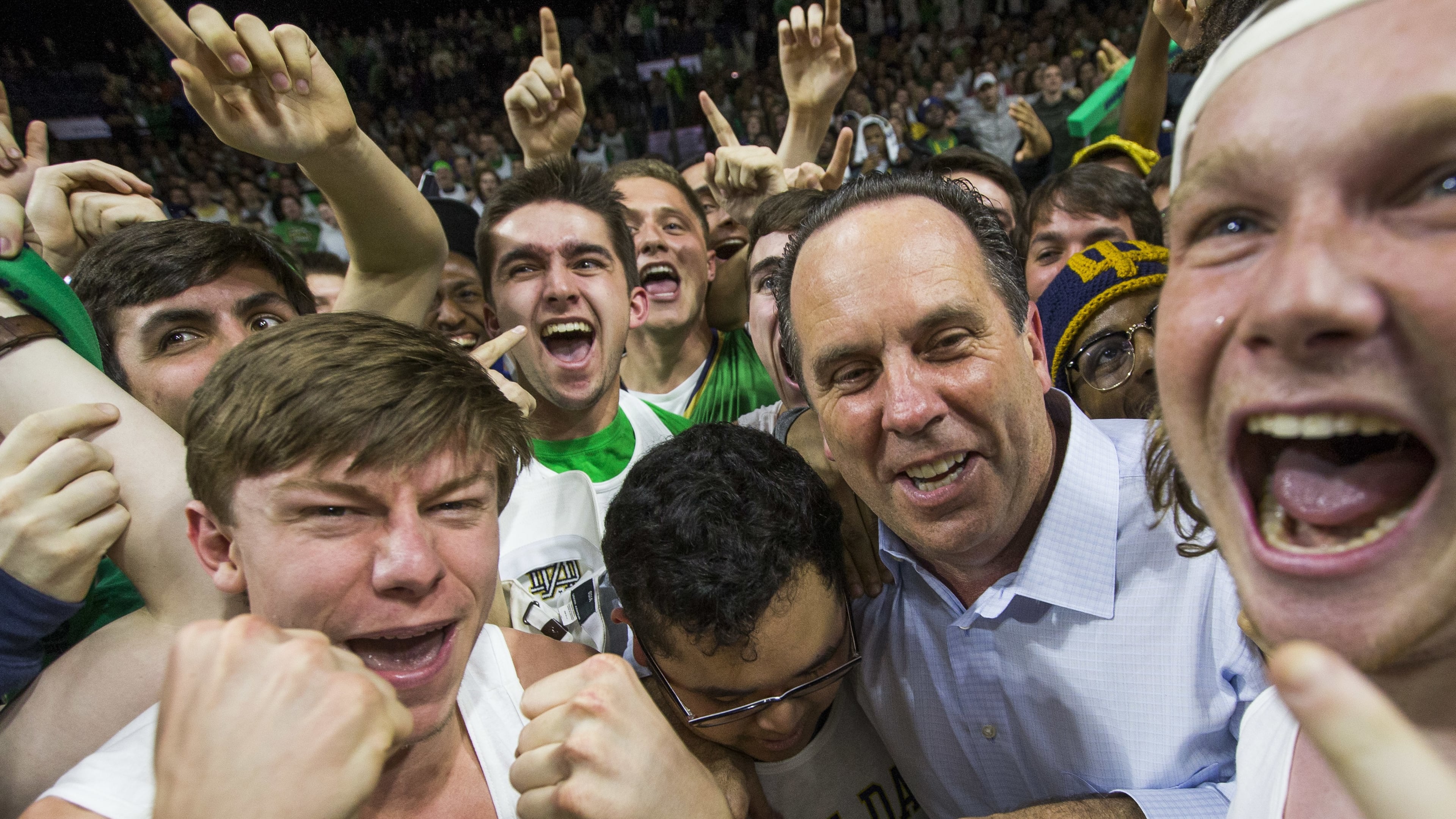 Notre Dame coach Mike Brey celebrates in the Notre Dame student section following his team’s game against Florida State on Saturday, Feb. 11, 2017, in South Bend, Ind. Notre Dame won 84-72. (AP Photo/Robert Franklin)