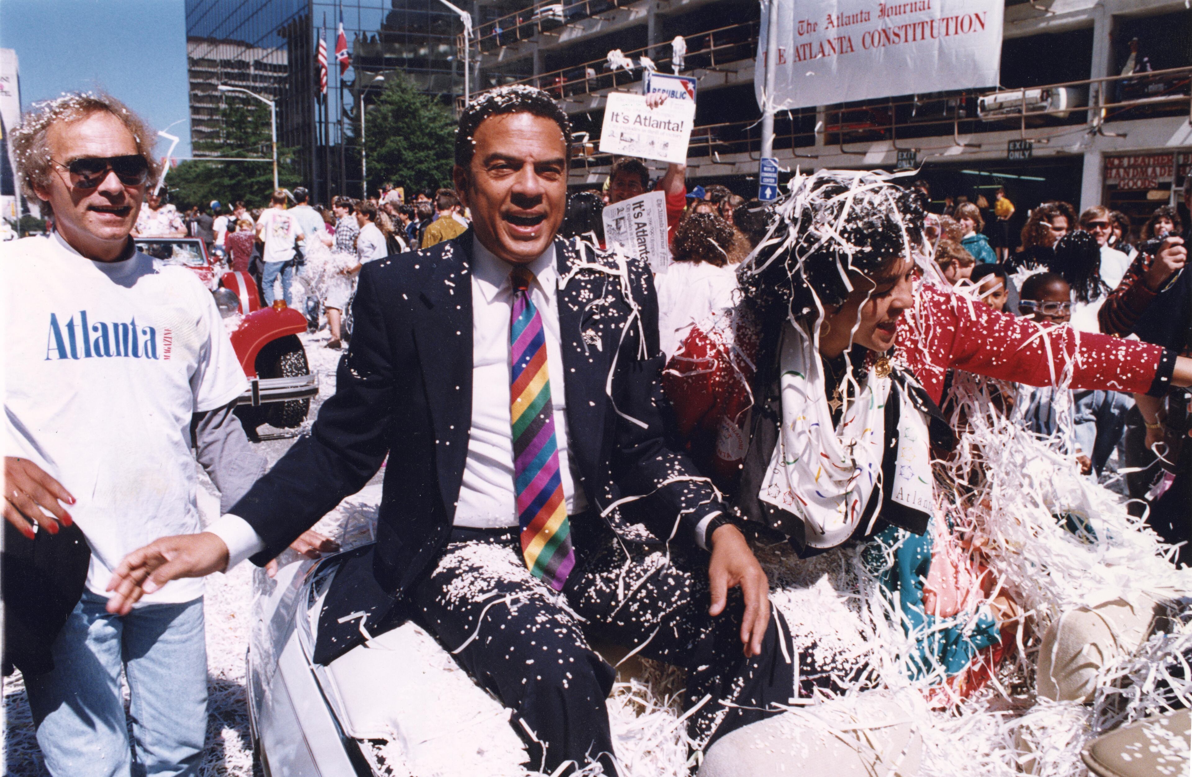 Mayor Andrew Young with his wife ride in the celebratory parade for Atlanta winning the Olympics bid. (AJC 1990)
