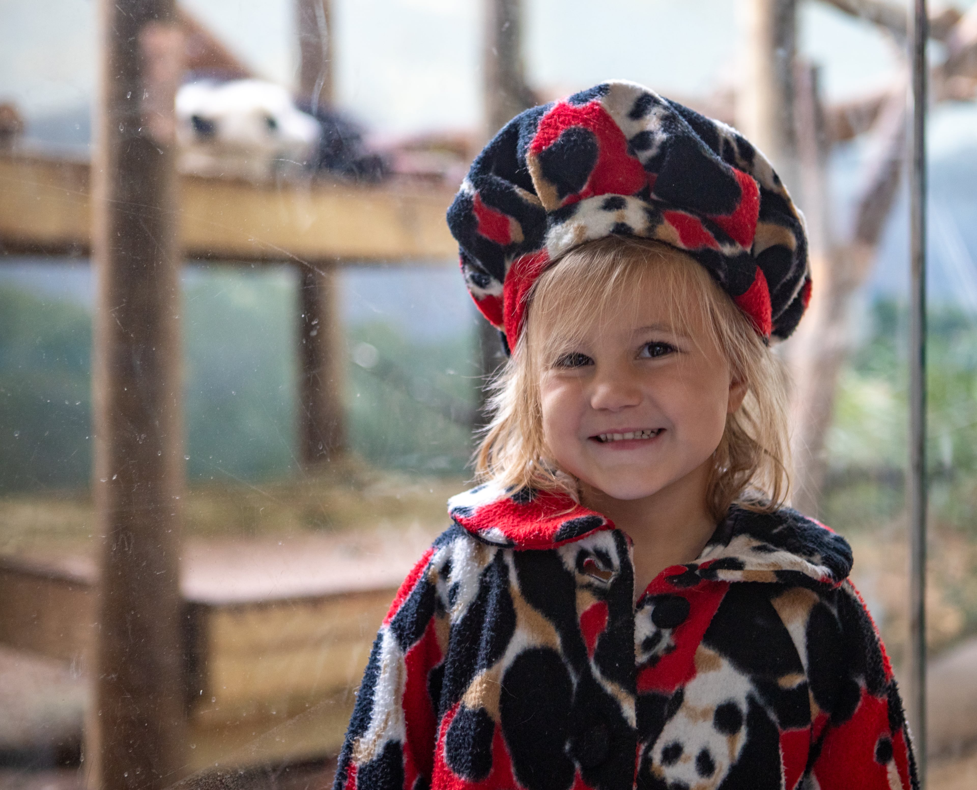 Albright Moore, 4, poses with Lun Lun while wearing the panda outfit her grandmother made her mother when the pandas first arrived in Atlanta. Hundreds wait in line at Zoo Atlanta for the Farewell Visit with the giant pandas on Saturday, Oct 5, 2024. Atlanta’s four pandas, Lun Lun, Yang Yang and their twins Ya Lun and Xi Lun, are returning to China after decades in Atlanta. (Jenni Girtman for The Atlanta Journal-Constitution)