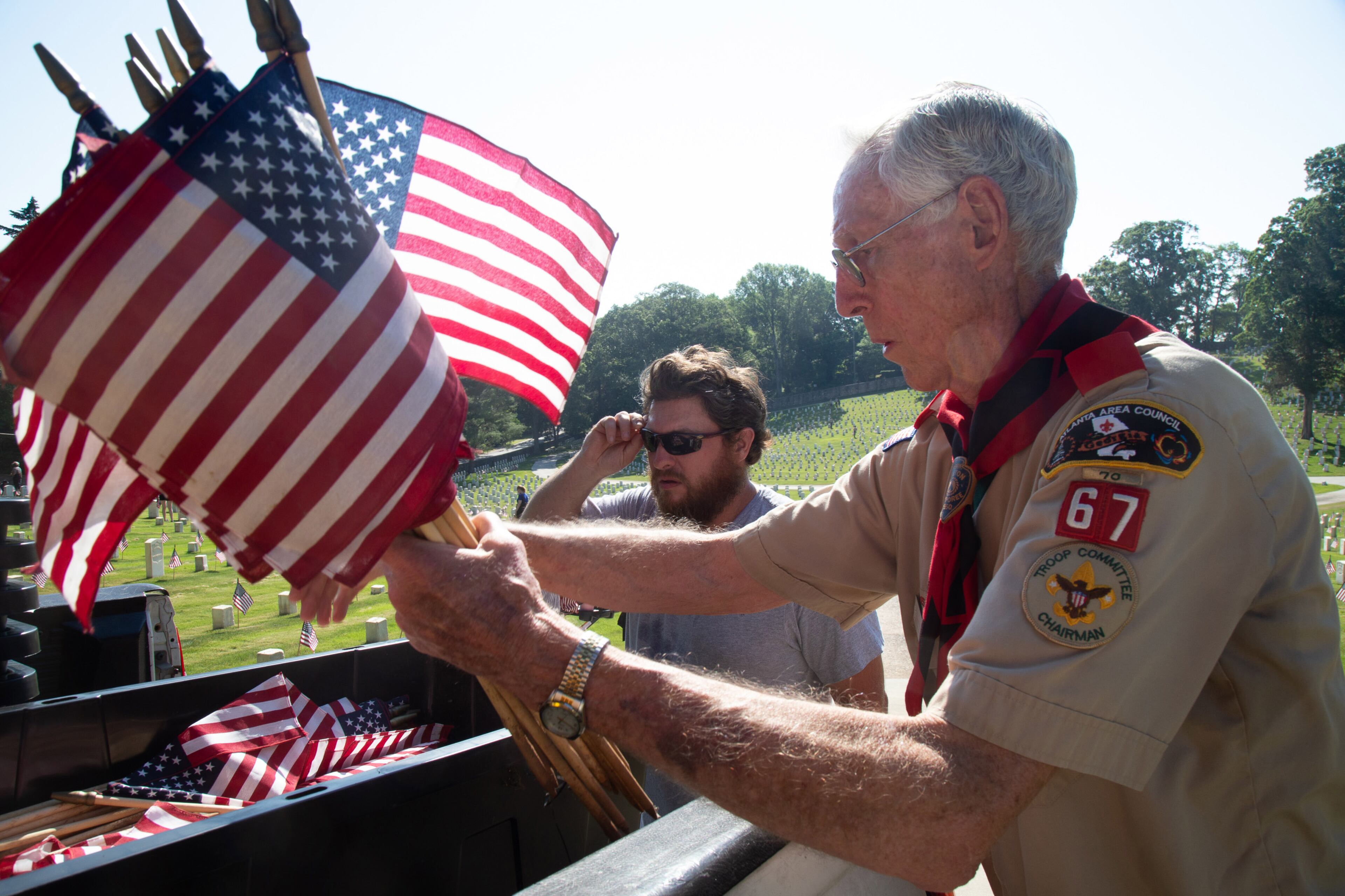 Volunteer Paul Vickers gets more flags to hand out at the Marietta National Cemetery on Saturday, May 25, 2019. Scouts placed an American flag at each of the 18,000 graves in advance of the Memorial Day commemorations.STEVE SCHAEFER / SPECIAL TO THE AJC
