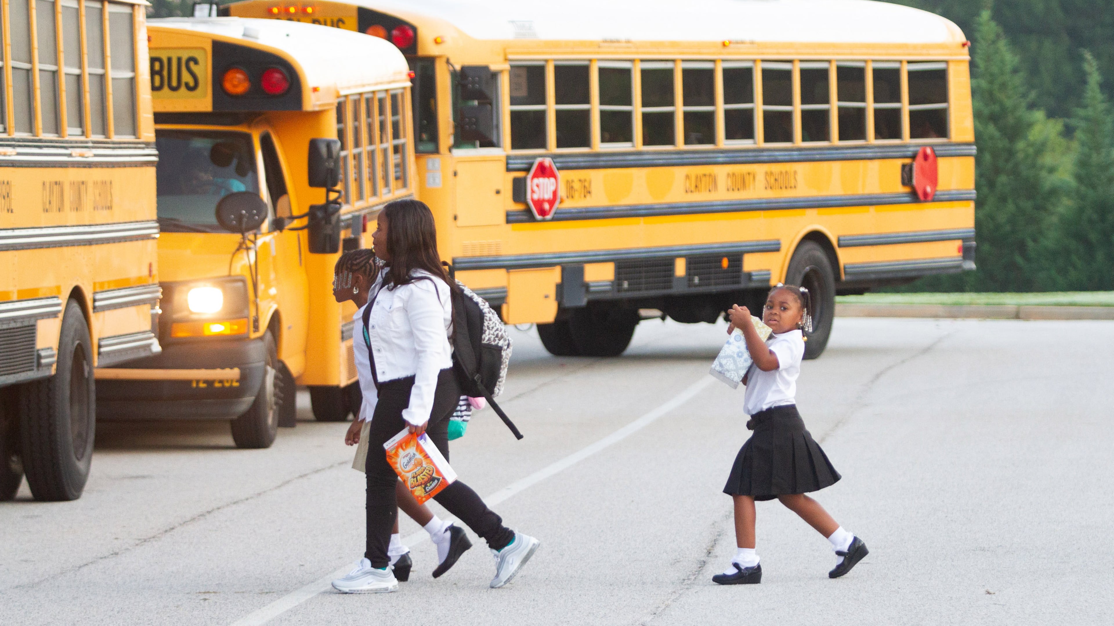 Kids head into James Jackson Elementary on the first day of school Monday, August 6, 2018, in Clayton County school system in Jonesboro GA.