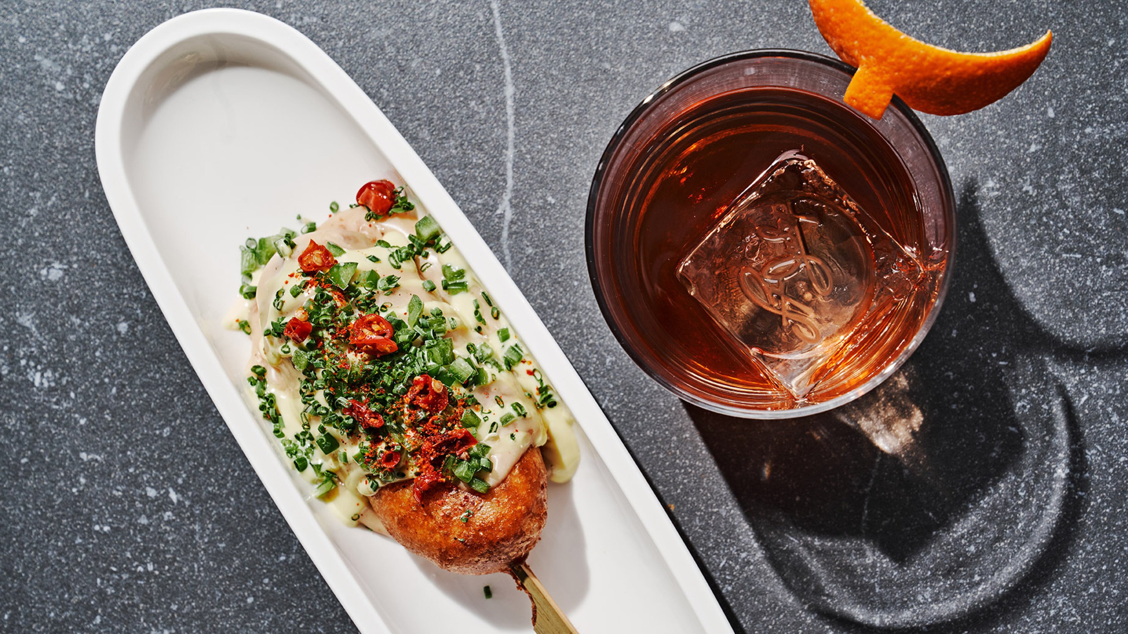 The Diplomat Corndog and 13th Street cocktail from St. Julep at Kimpton Sylvan Hotel. / Photo by Andrew Thomas Lee