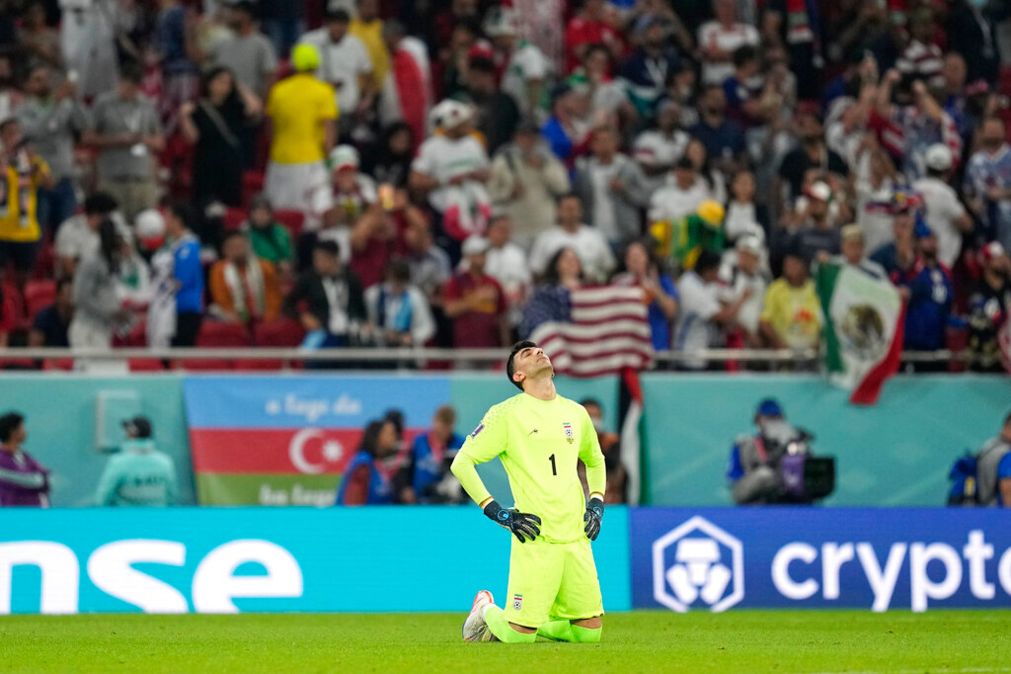 Iran's goalkeeper Alireza Beiranvand looks up at the end of the World Cup group B soccer match between Iran and the United States at the Al Thumama Stadium in Doha, Qatar, Wednesday, Nov. 30, 2022. (AP Photo/Ebrahim Noroozi)