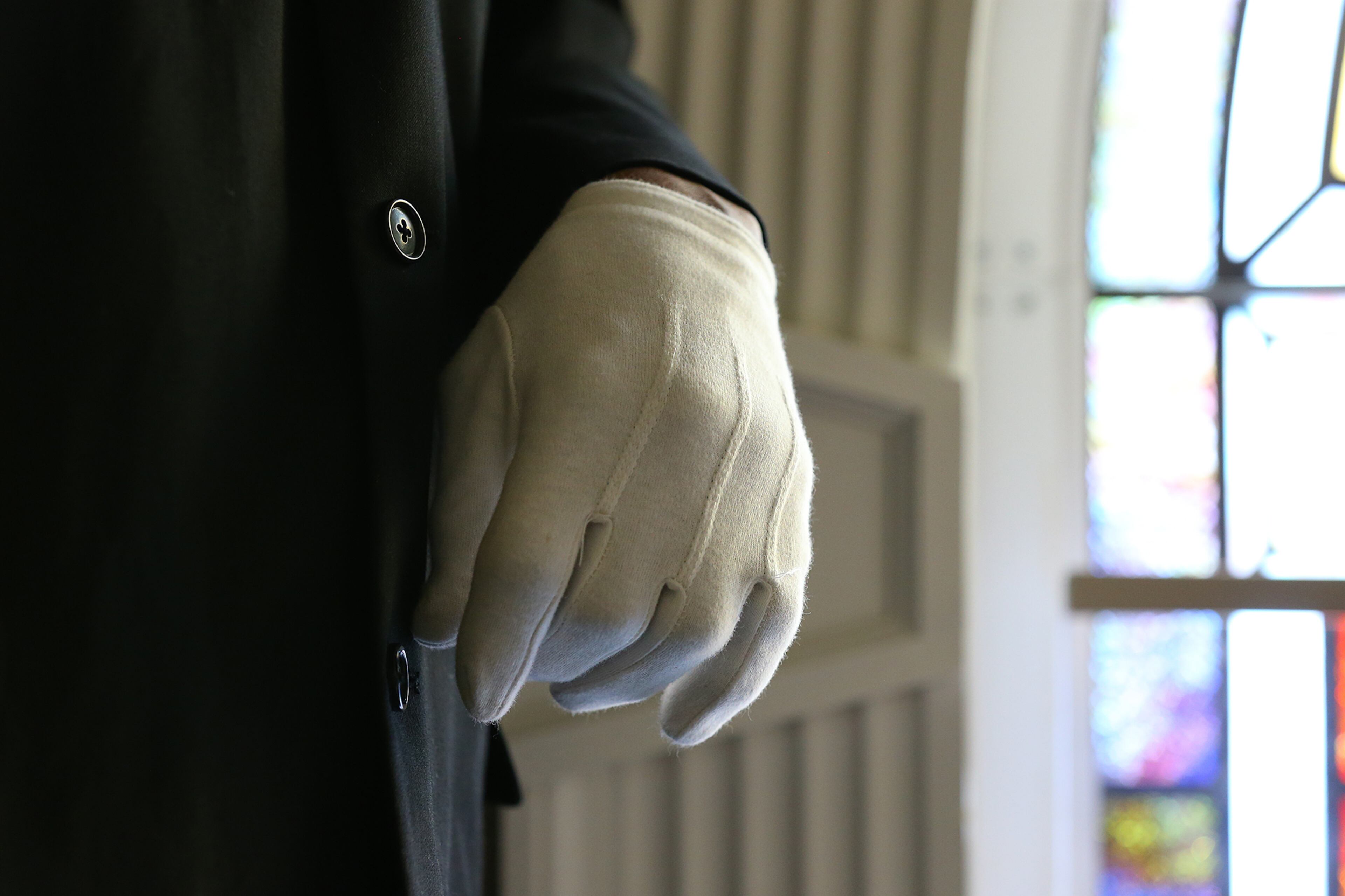 Usher Michael Williams, wearing a black suit and white gloves, watches over the needs of the congregation during the Entrance Service at Mount Vernon Baptist Church on Palm Sunday, March 29, 2015, in Atlanta. Curtis Compton / ccompton@ajc.com