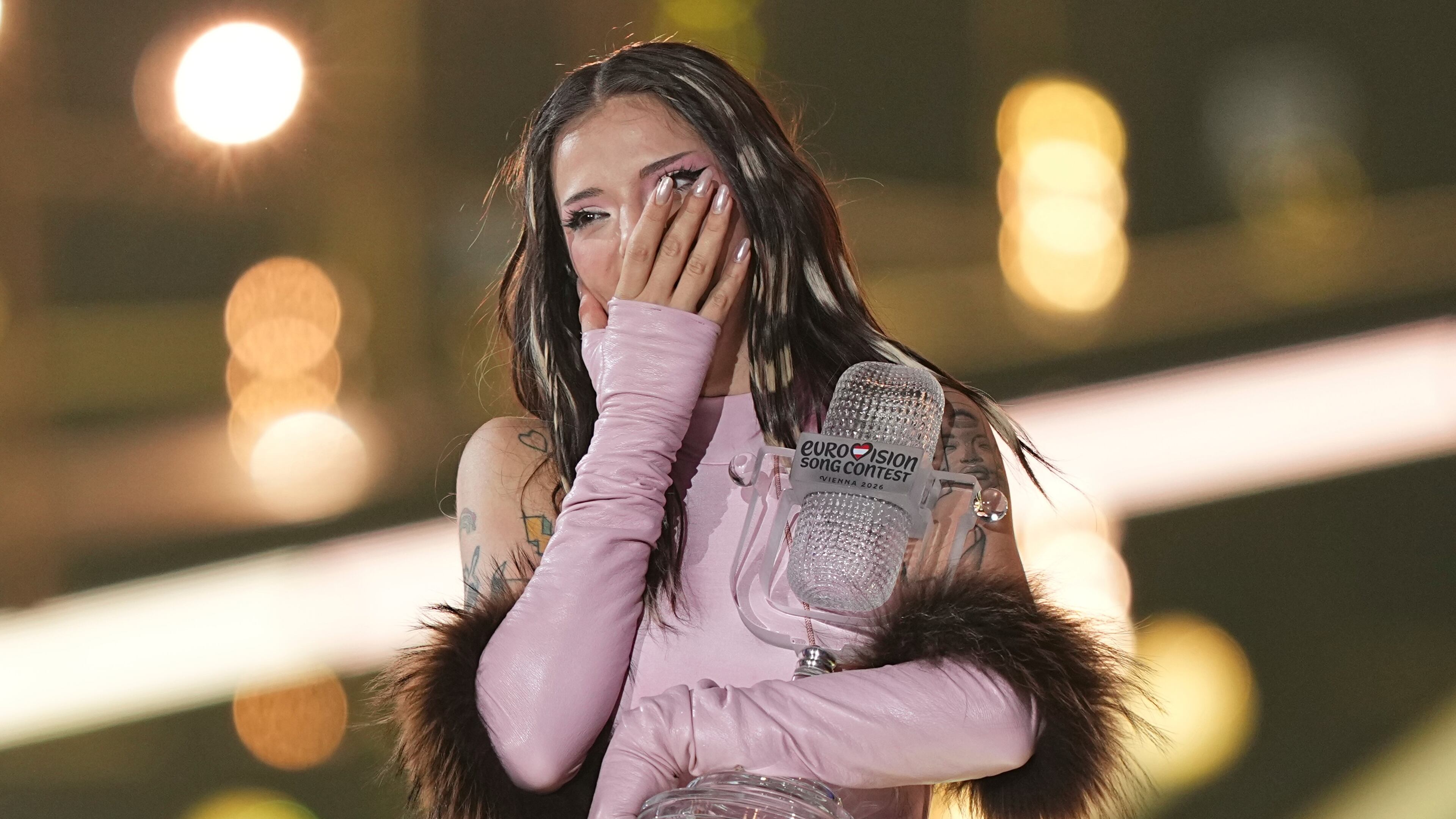 Dara from Bulgaria reacts as she holds the trophy after winning the Grand Final of the 70th Eurovision Song Contest in Vienna, Austria, Sunday, May 17, 2026. (AP Photo/Martin Meissner)
