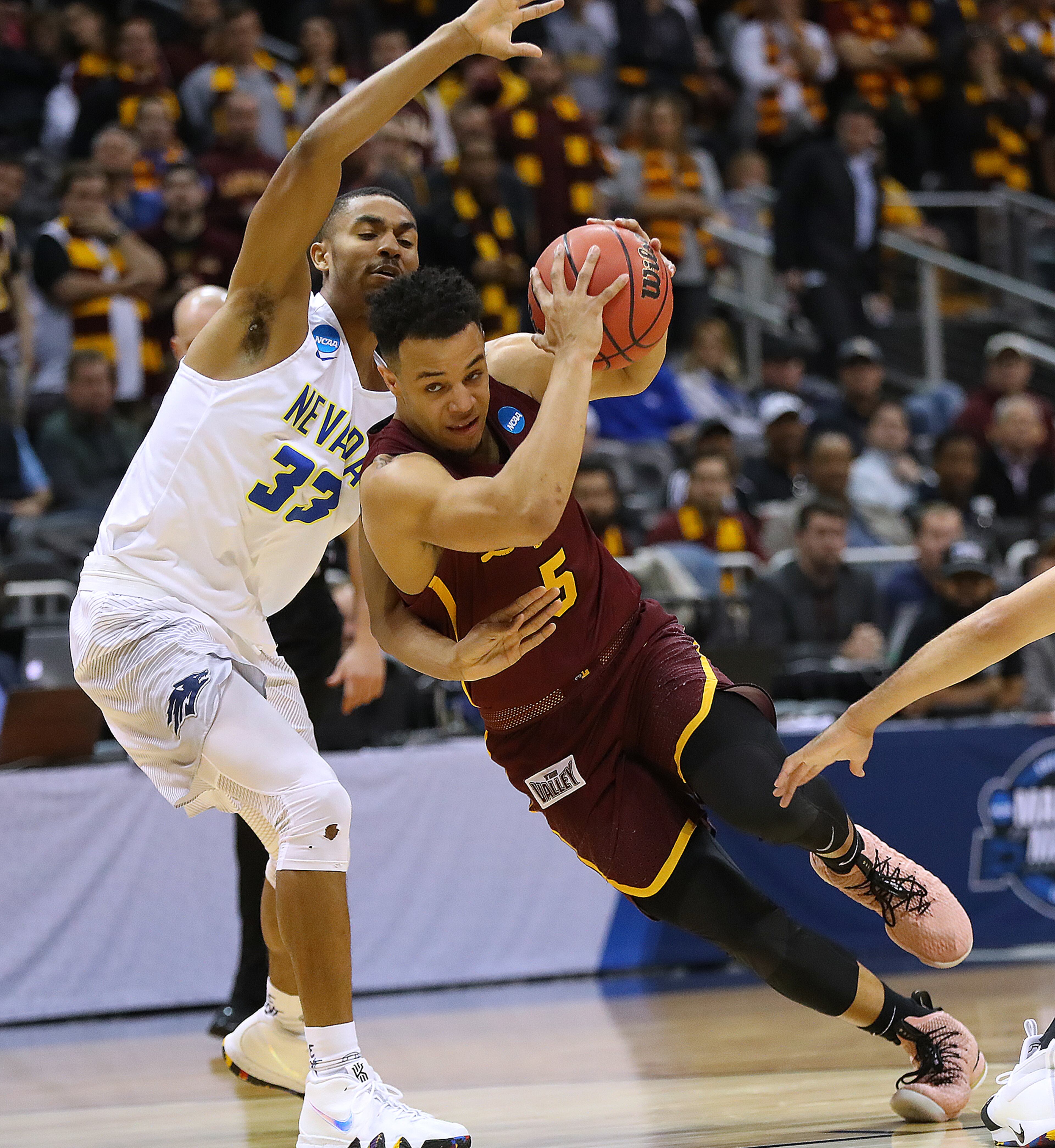 March 22, 2018 Atlanta: Loyola guard Marques Townes trys to drive against Nevada defender Josh Hall during the first half of a regional semifinal NCAA college basketball game on Thursday, March 22, 2018, in Atlanta. Curtis Compton/ccompton@ajc.com