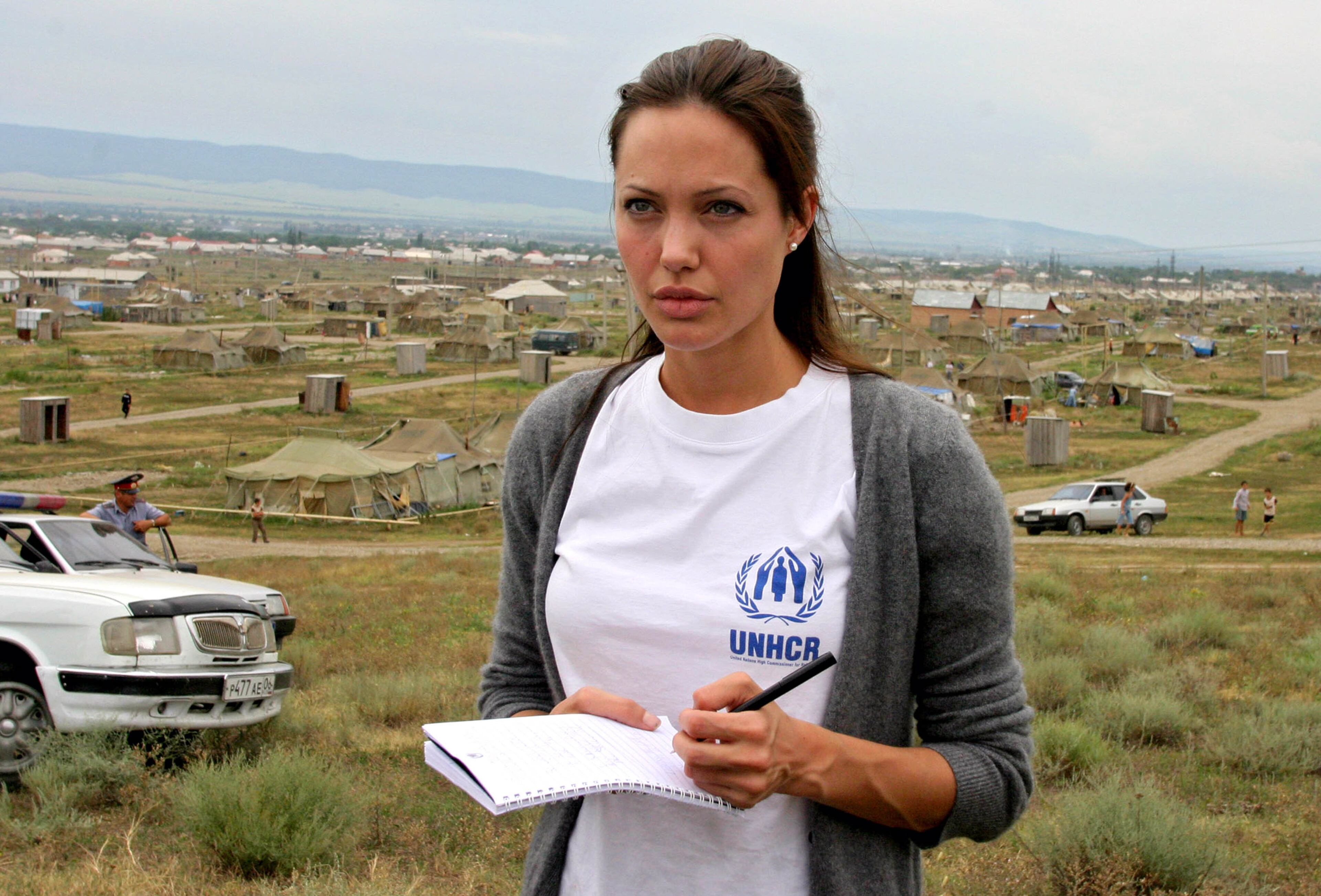 Actress Angelina Jolie visits Bella refugee camp August 22, 2003 in Ingushetia, near the Chechen border in Russia's North Caucasus region. Jolie, a Goodwill Ambassador for the UN High Commissioner for Refugees, arrived August 22 in North Caucasus region. (Photo by Tanya Makeeva-Pool/Getty Images)