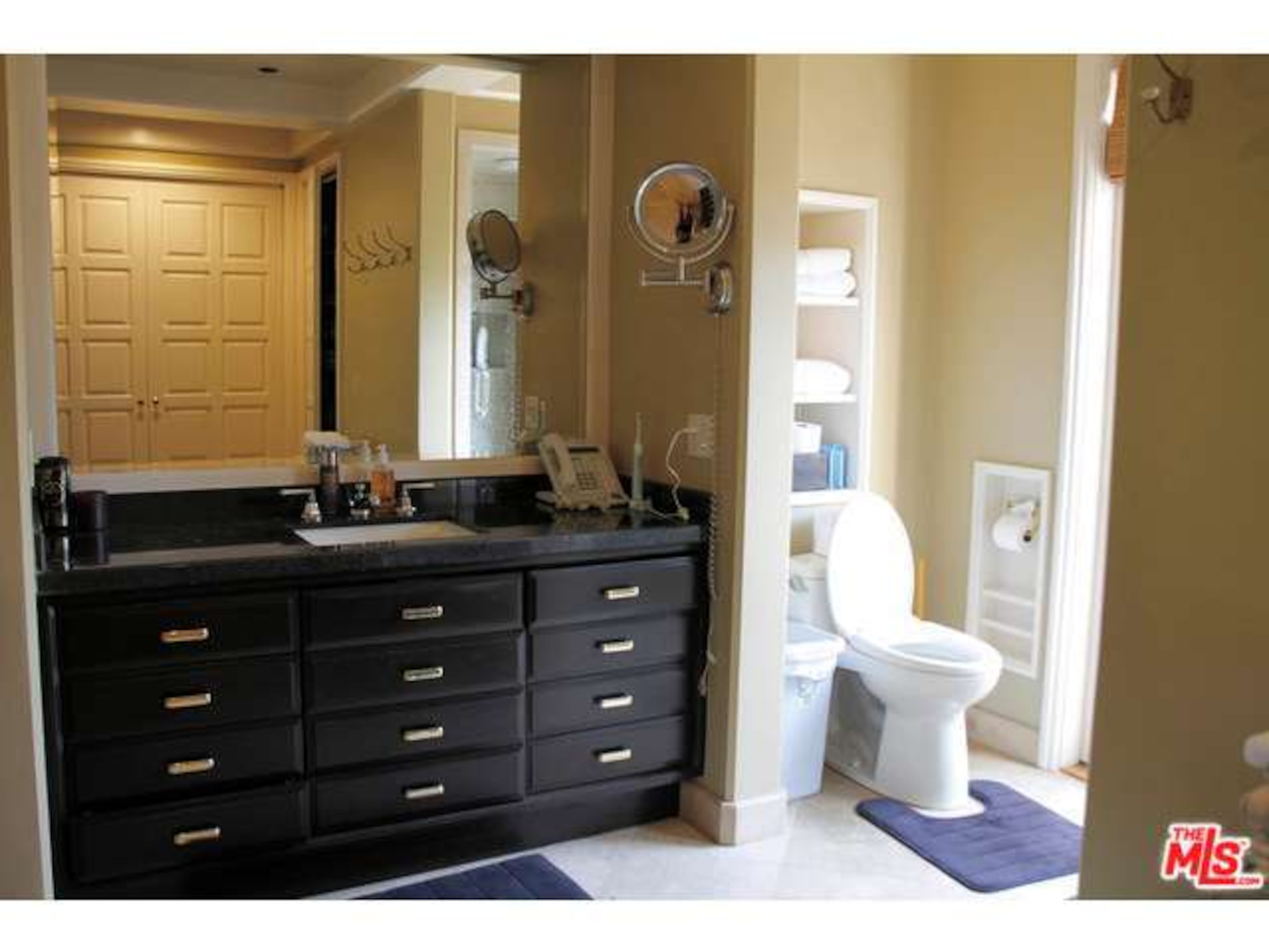 His and her baths in the sumptuous master suite have direct access to the spa. Information: http://www.redfin.com/CA/Tarzana/5143-Otis-Ave-91356/home/4110687