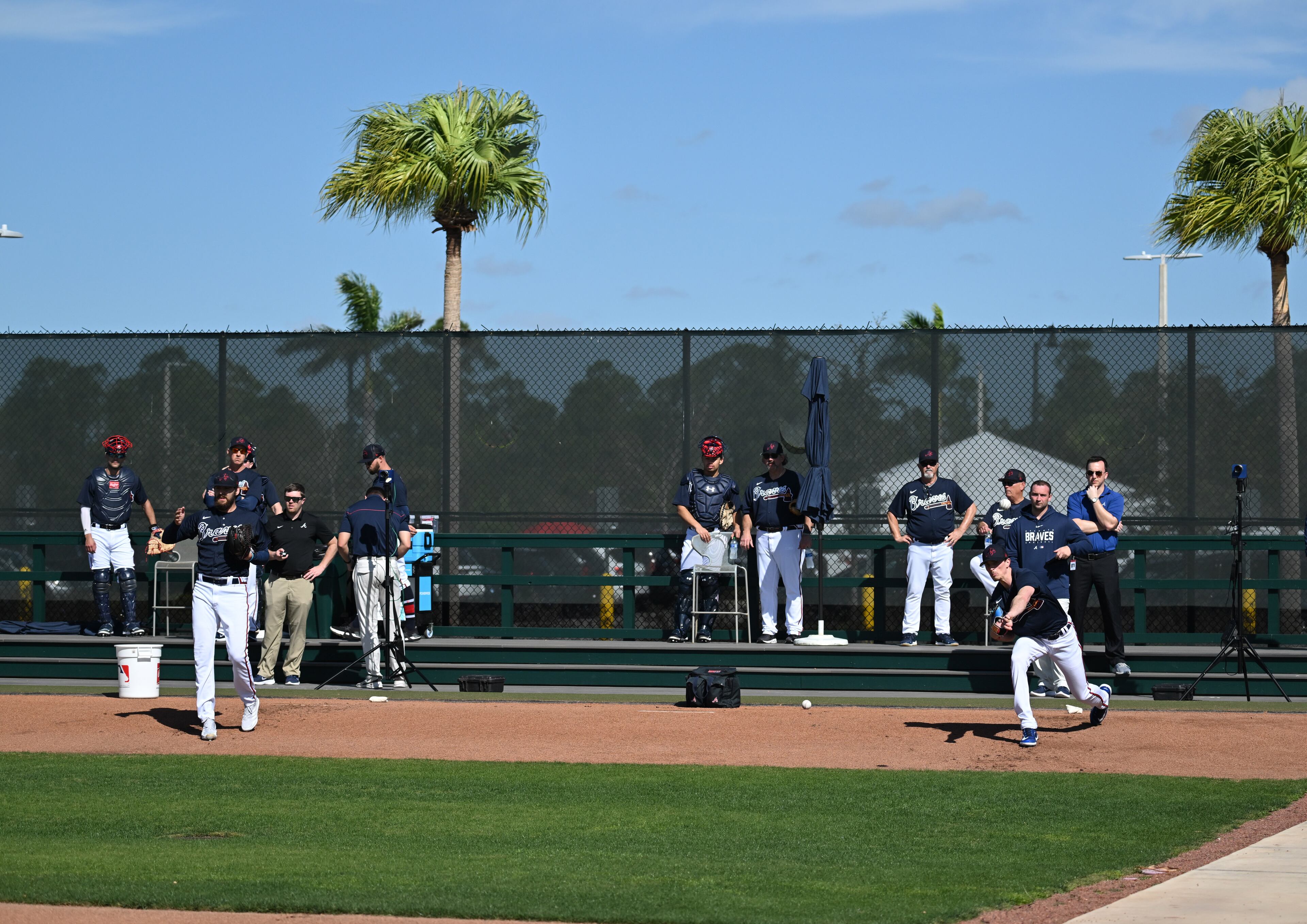 Braves pitcher Ian Anderson (left) and pitcher Max Fried deliver during spring training Thursday at CoolToday Park in North Port, Florida. (Hyosub Shin / Hyosub.Shin@ajc.com)