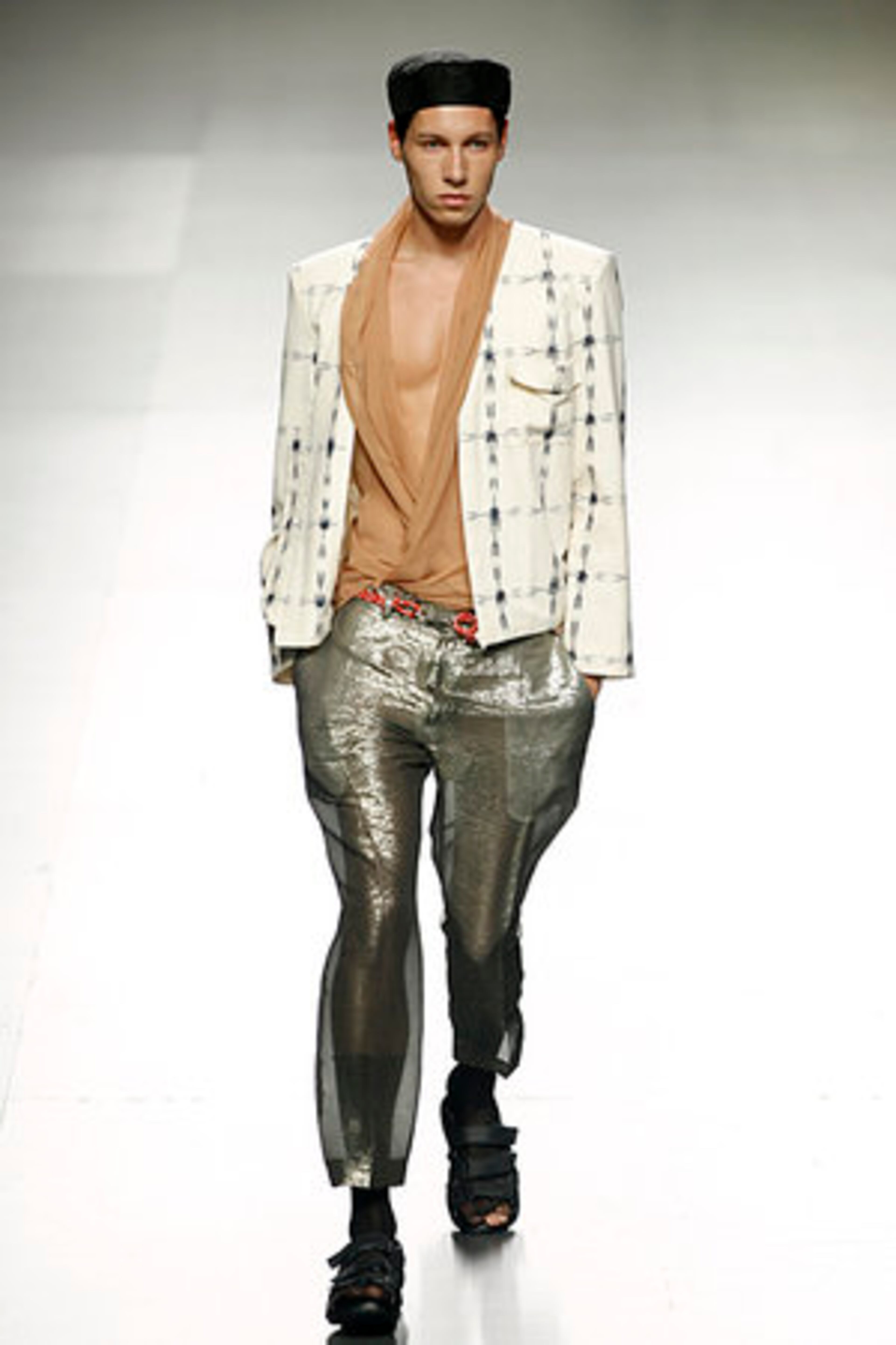 A model shimmers in this Spring/Summer design by Alberto Puras during the Ego for young designers at the Pasarela Cibeles fashion show, in Madrid, Tuesday, Sept. 20, 2011.