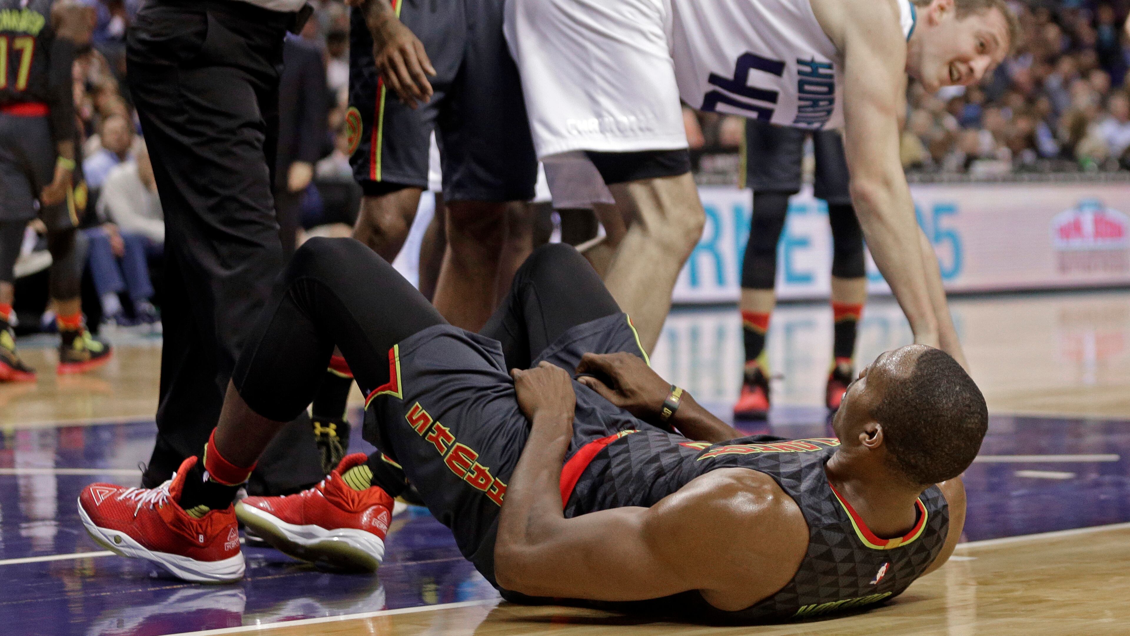 Atlanta Hawks’ Dwight Howard, bottom, is called for a foul on Charlotte Hornets’ Cody Zeller, top, in the second half of an NBA basketball game in Charlotte, N.C., Friday, Nov. 18, 2016. Howard was called for flagrant foul on the play and ejected from the game. The Hornets won 100-96. (AP Photo/Chuck Burton)