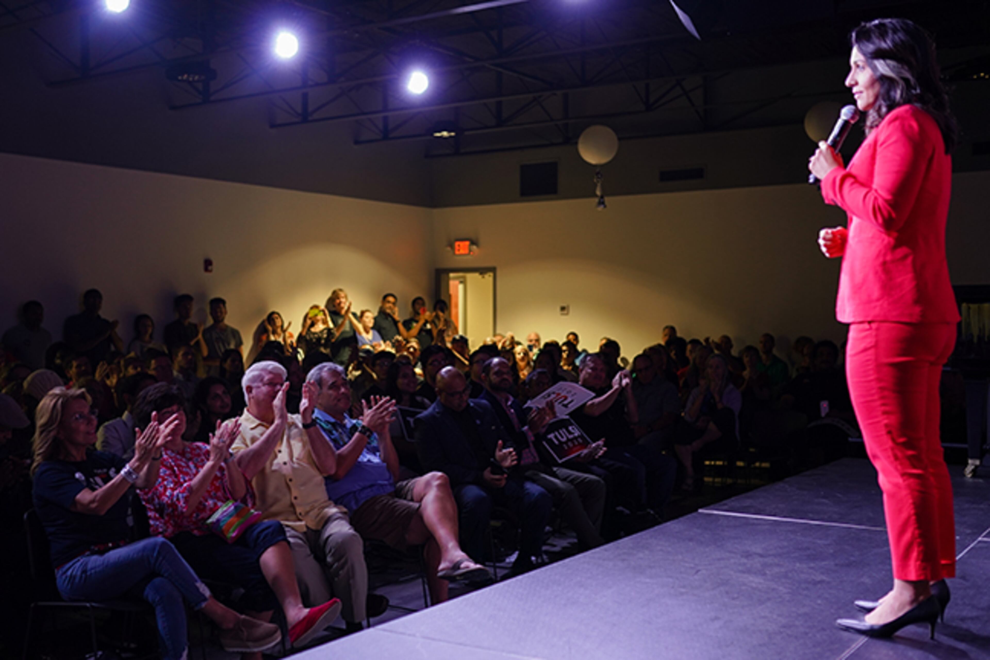 Attendees clap as U.S. Congresswoman and Democratic candidate for president Tulsi Gabbard, (D-HI), speaks during a campaign event at Atlanta Music Project on Friday, August 30, 2019, in Atlanta. (Elijah Nouvelage for The Atlanta Journal Constitution)