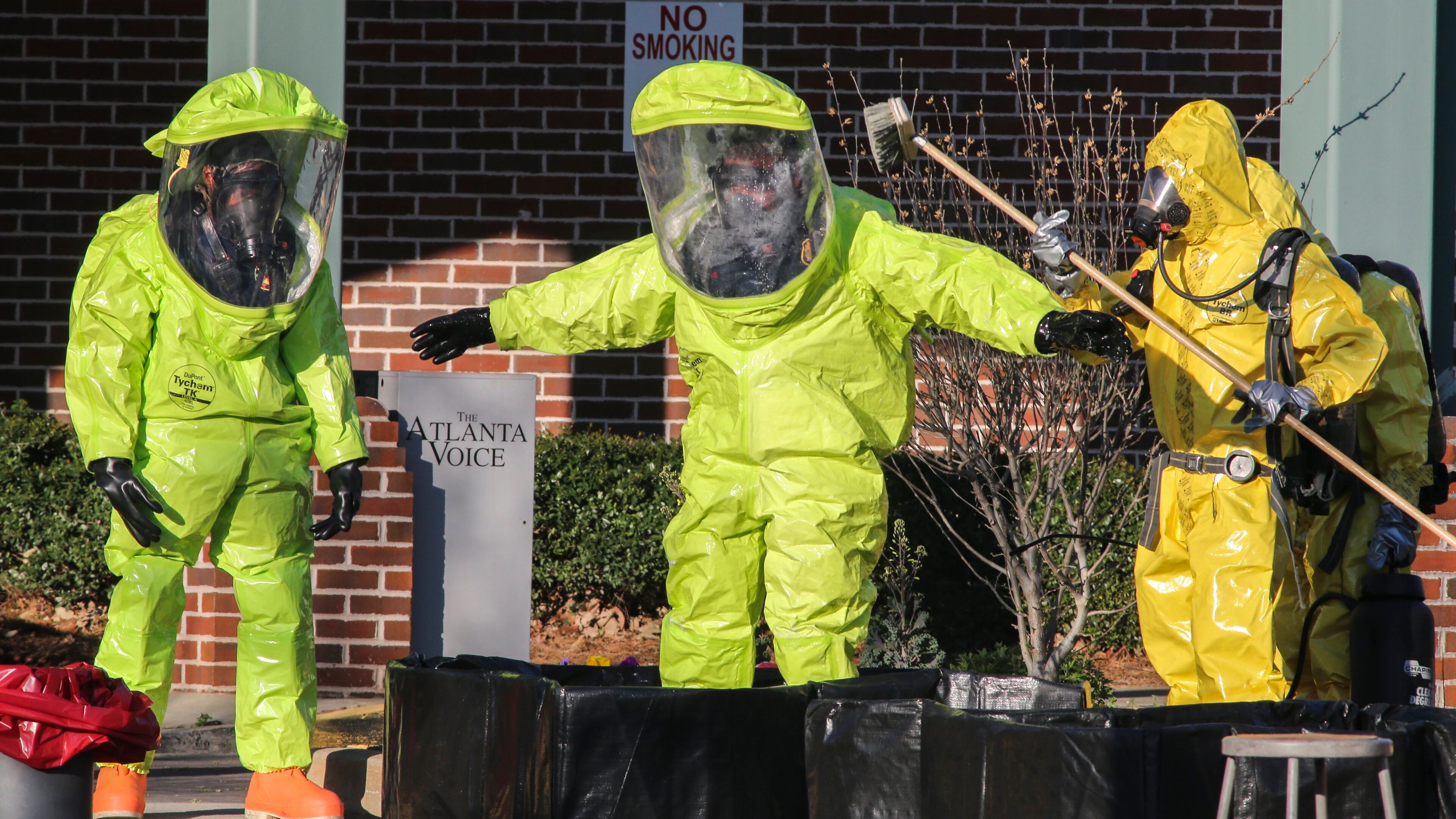 Atlanta firefighters responded to the Helene Mills Senior Center in downtown Atlanta around 8 a.m. Tuesday, March 22, 2016, with their decontamination and hazardous materials teams after a pool maintenance worker discovered a chemical leak in a pool storage area. JOHN SPINK / JSPINK@AJC.COM