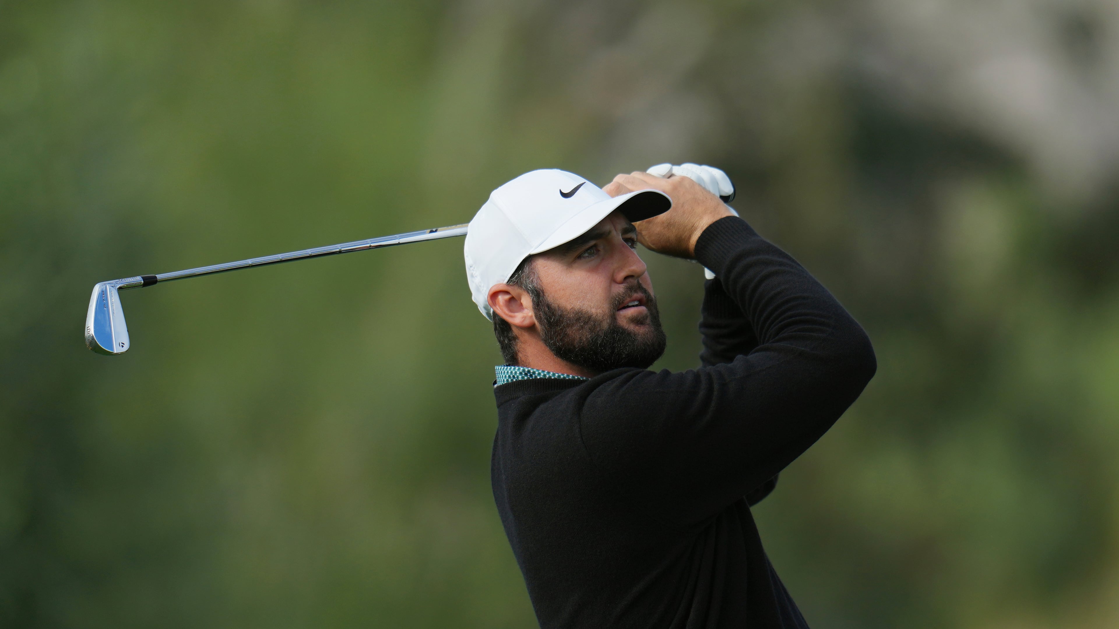 Scottie Scheffler watches his shot from the third tee during the first round of the American Express golf event at La Quinta County Club Thursday, Jan. 22, 2026, in La Quinta, Calif. (AP Photo/Ross D. Franklin)