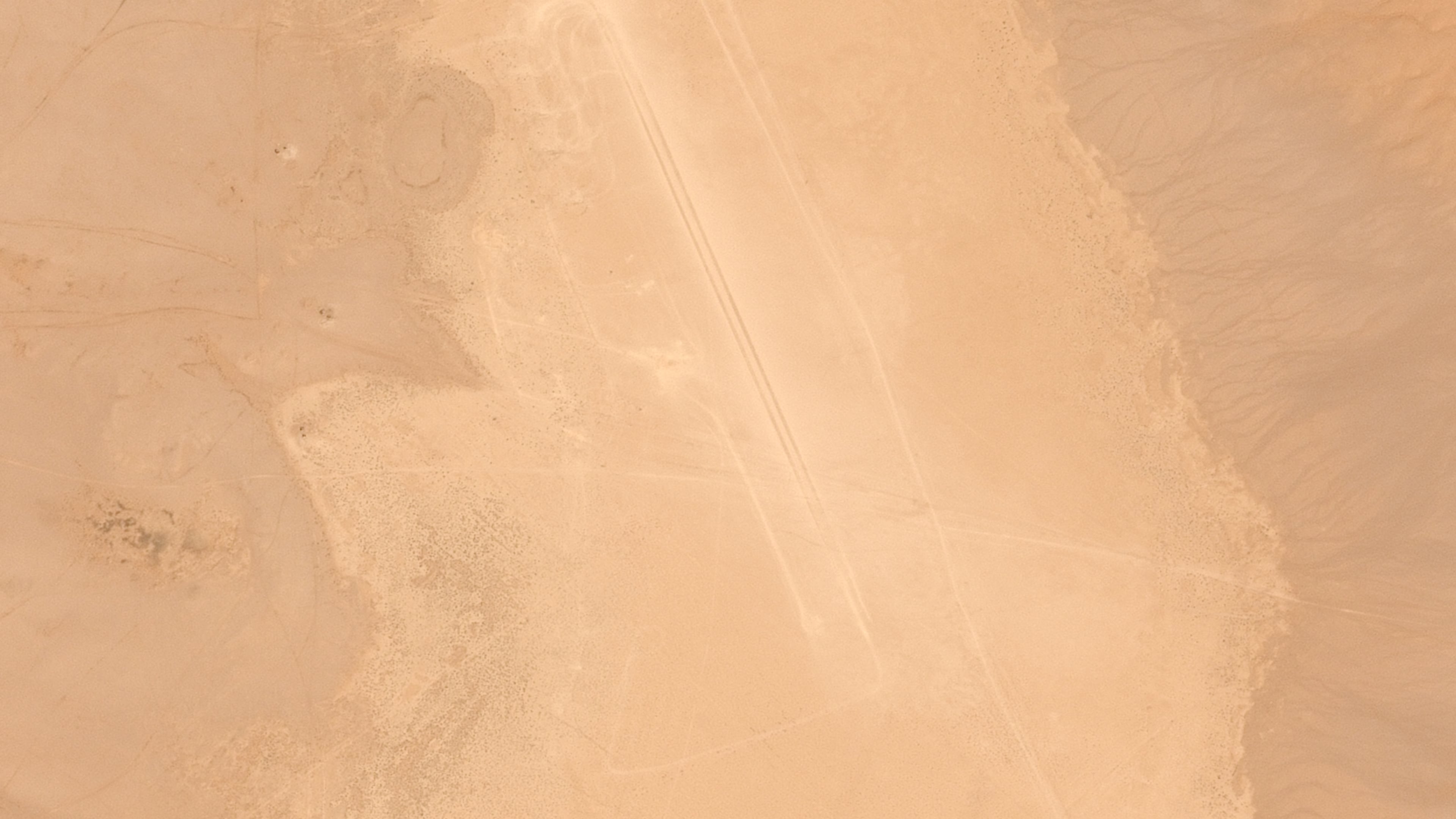 This satellite image provided by Airbus DS shows what appears to be a human-made track dug out in Iraq's western Nukhaib desert, some 250 kilometers (155 miles), southwest of the capital, Baghdad, on Sunday, March 8, 2026. (© Airbus DS 2026 via AP)
