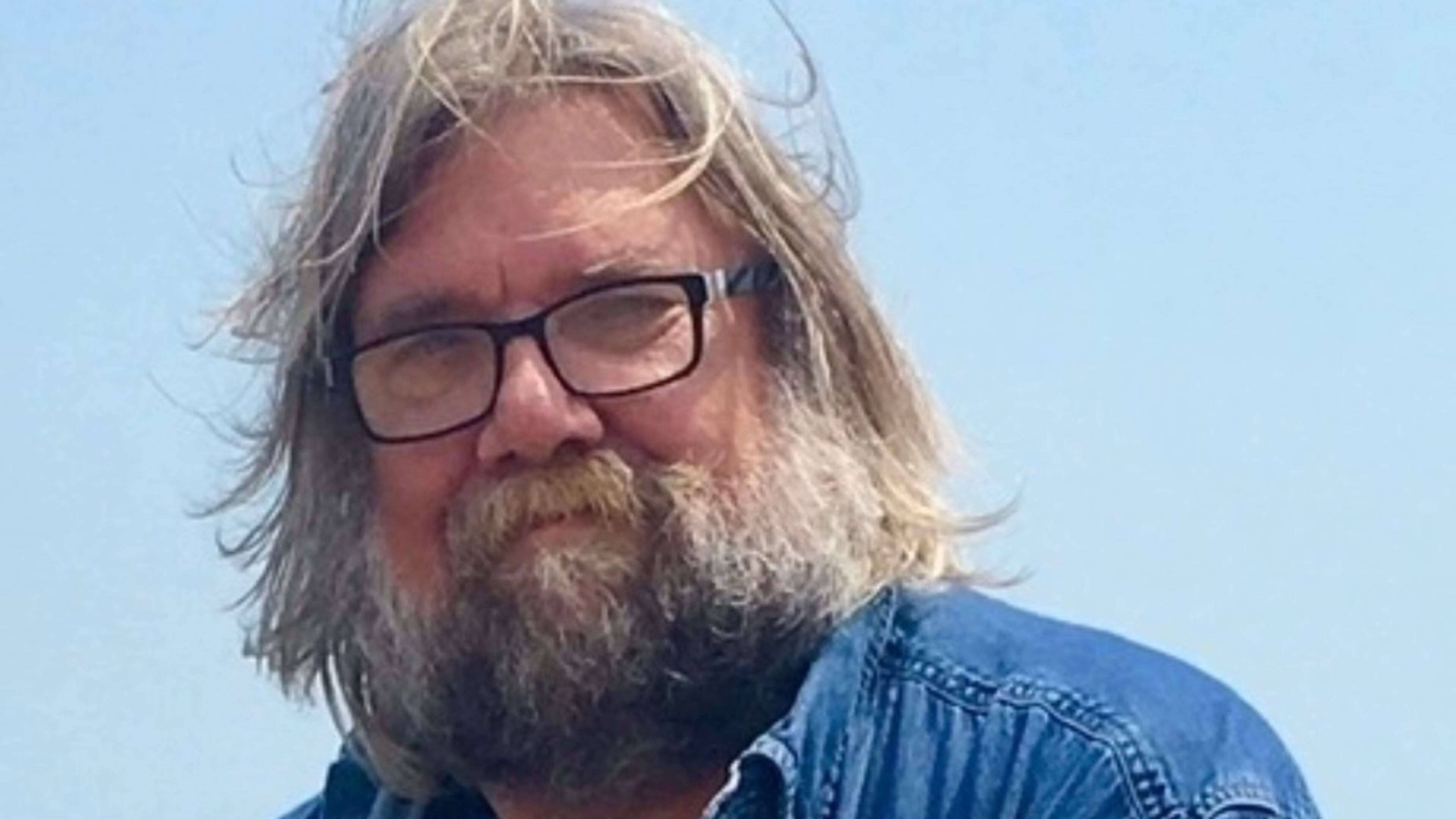 This undated photo released by Emily Joy Schumacher shows Michael Schumacher, a Wisconsin author who produced a diverse array of works ranging from biographies of filmmaker Francis Ford Coppola and musician Eric Clapton to accounts of Great Lakes shipwrecks. (Emily Joy Schumacher via AP)