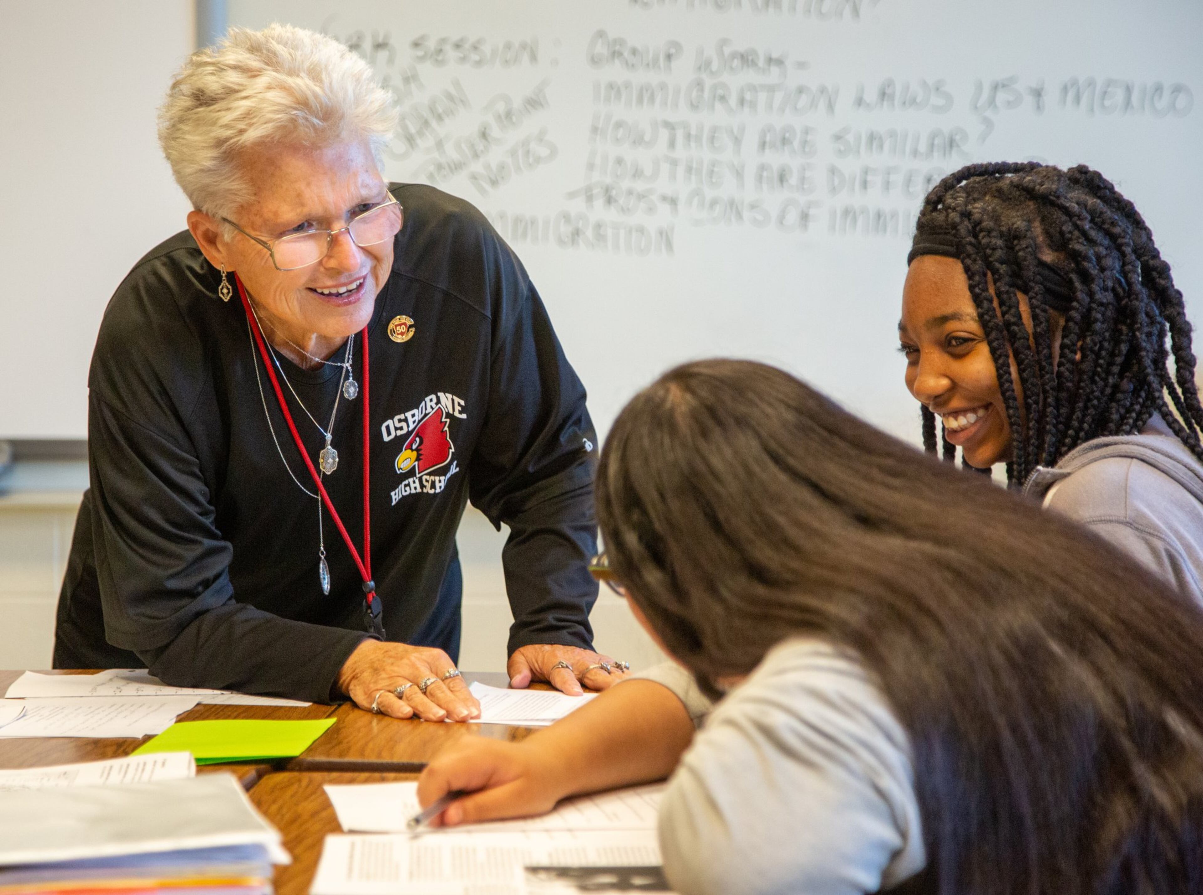 Annette Hansard laughs with a couple of her Osborne High School students on Friday Sept. 20th, 2019. She recently celebrated her 50th year of teaching social studies in the Cobb County School District. She has been at Osborne the entire time and is the department chair of the school’s social studies department. PHIL SKINNER