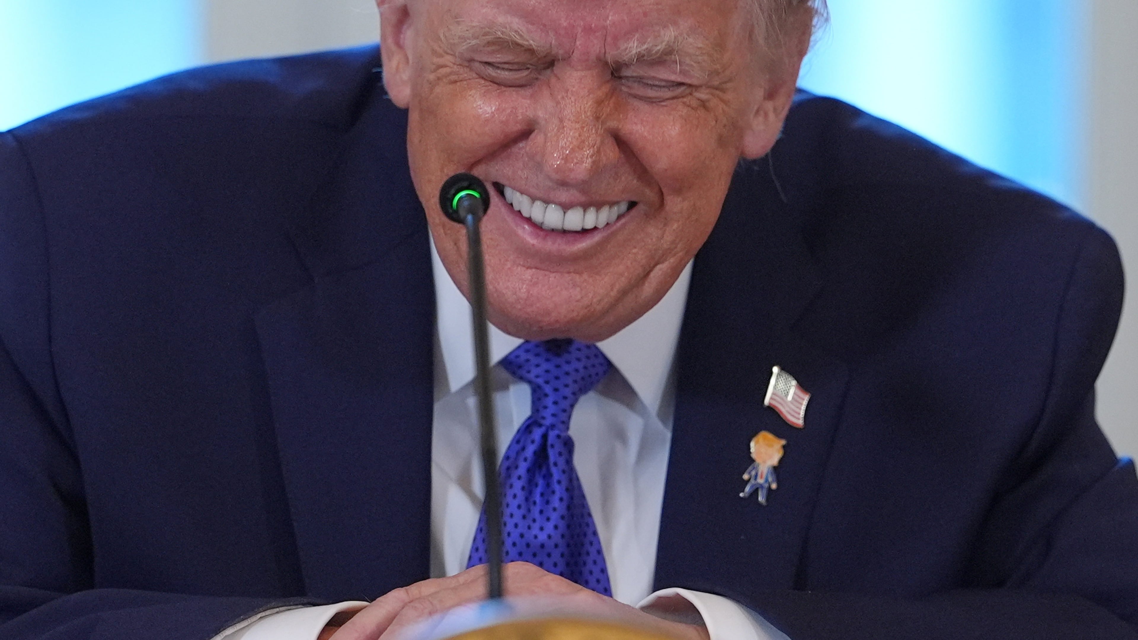 President Donald Trump laughs during a meeting with oil executives in the East Room of the White House, Friday, Jan. 9, 2026, in Washington. (AP Photo/Evan Vucci)
