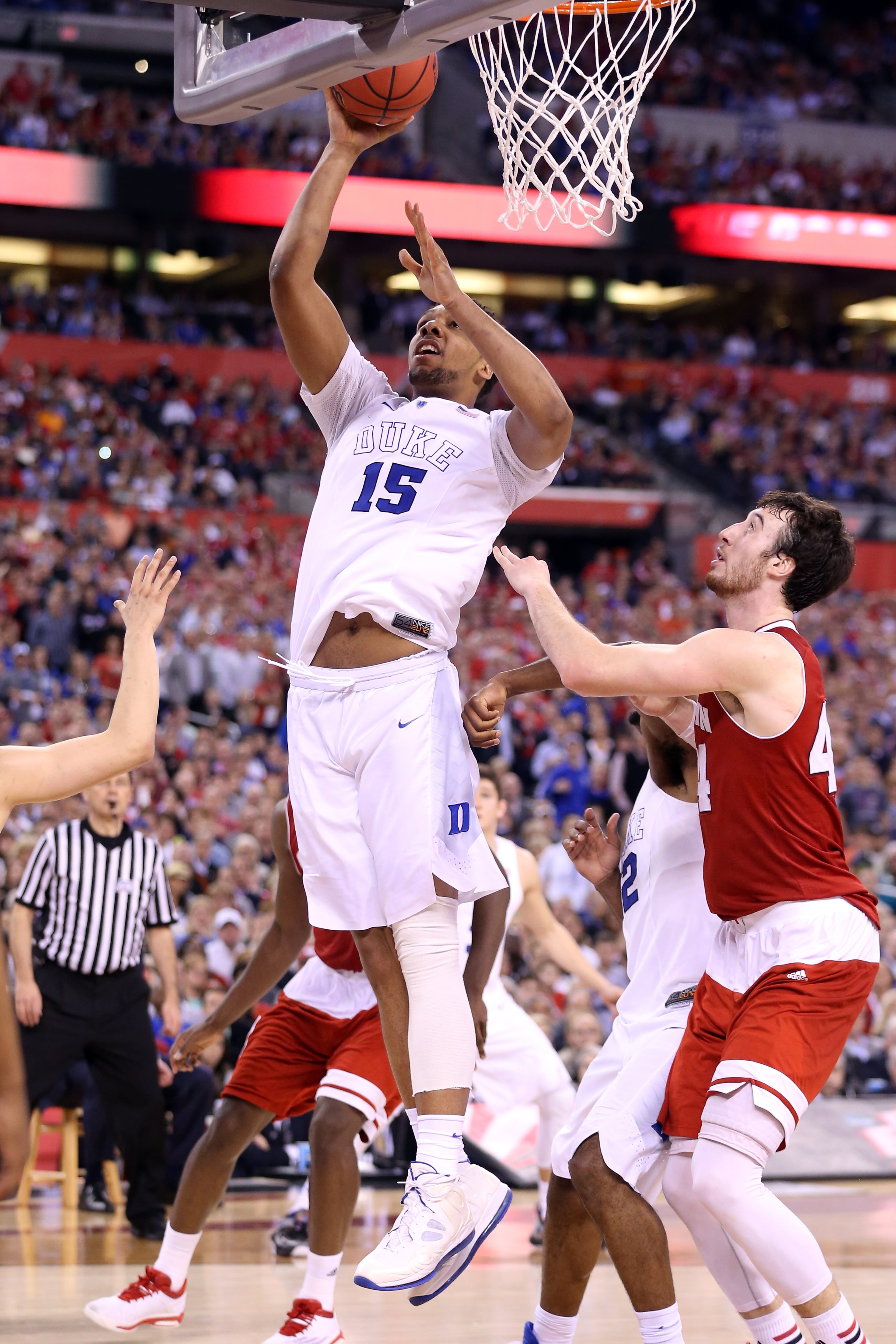 INDIANAPOLIS, IN - APRIL 06: Jahlil Okafor #15 of the Duke Blue Devils drives to the basket against Frank Kaminsky #44 of the Wisconsin Badgers in the second half during the NCAA Men's Final Four National Championship at Lucas Oil Stadium on April 6, 2015 in Indianapolis, Indiana. (Photo by Andy Lyons/Getty Images)