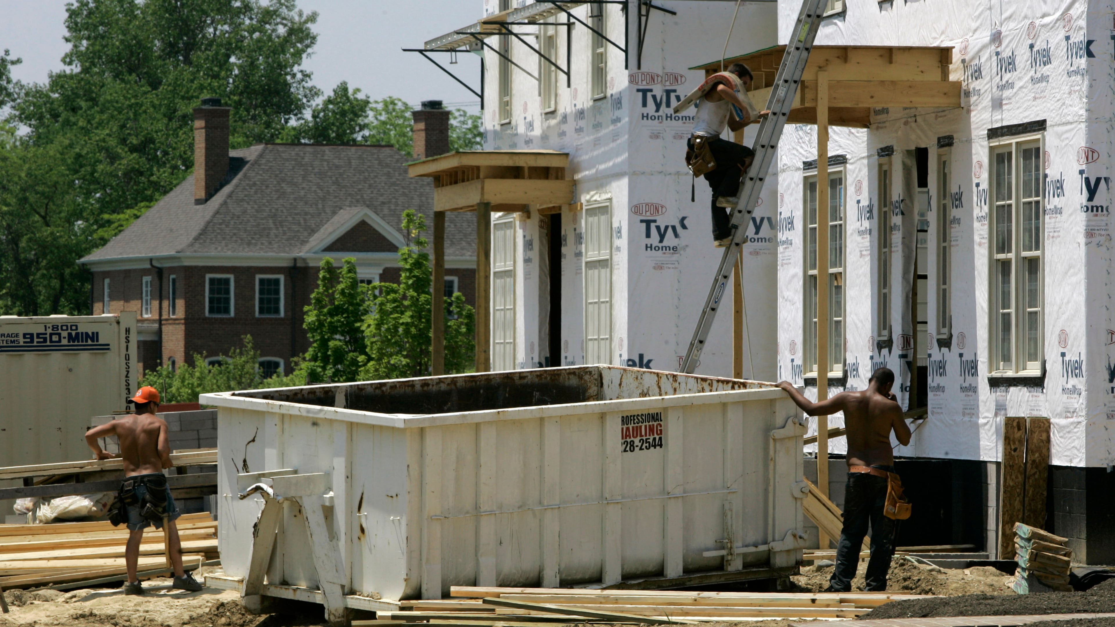 FILE - Luxury homes are under construction in a subdivision, May 22, 2007 in New Albany, Ohio. (AP Photo/Kiichiro Sato, File)