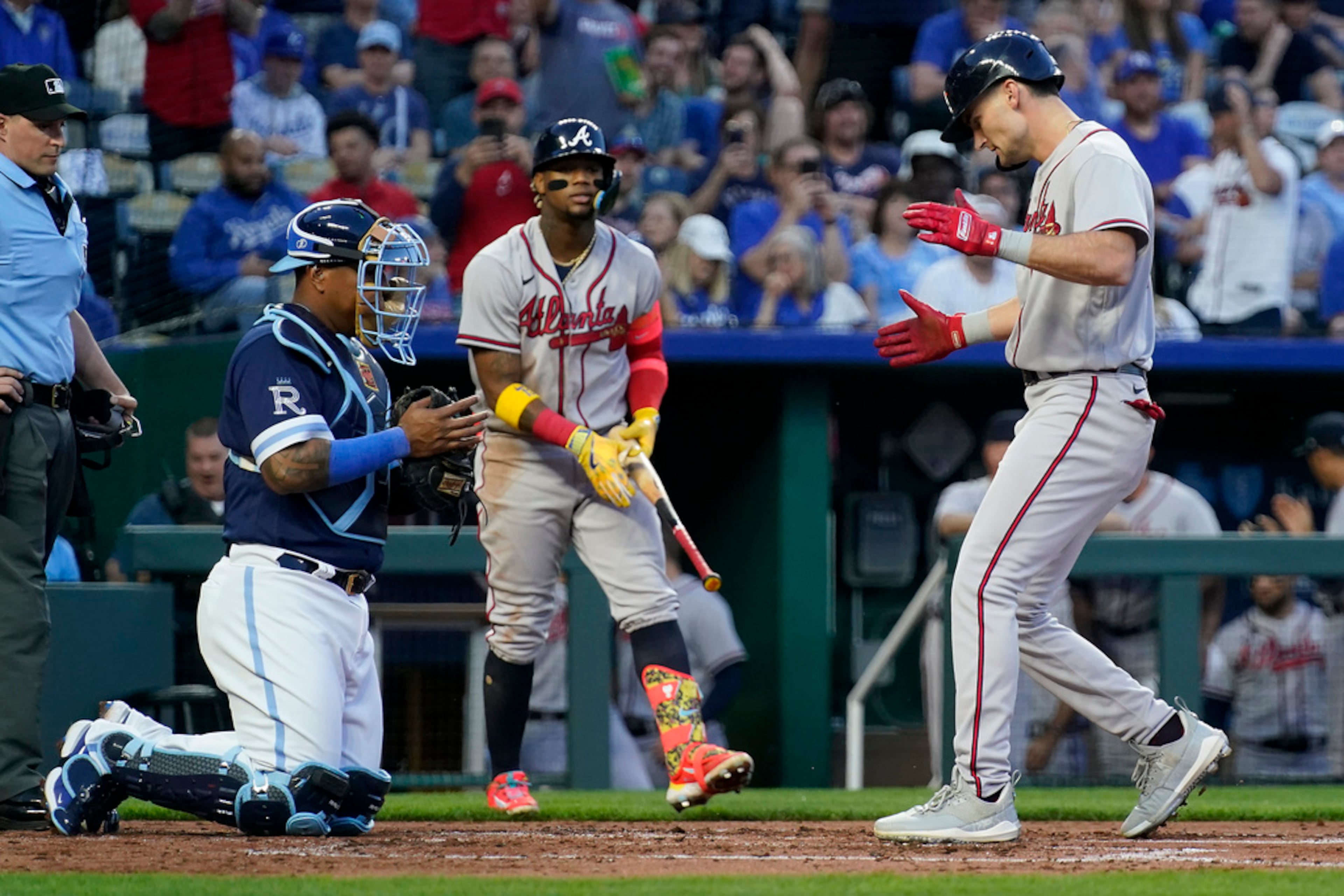 Atlanta Braves' Sam Hilliard celebrates as he crosses the plate after hitting a solo home run during the second inning of a baseball game against the Kansas City Royals Friday, April 14, 2023, in Kansas City, Mo. (AP Photo/Charlie Riedel)