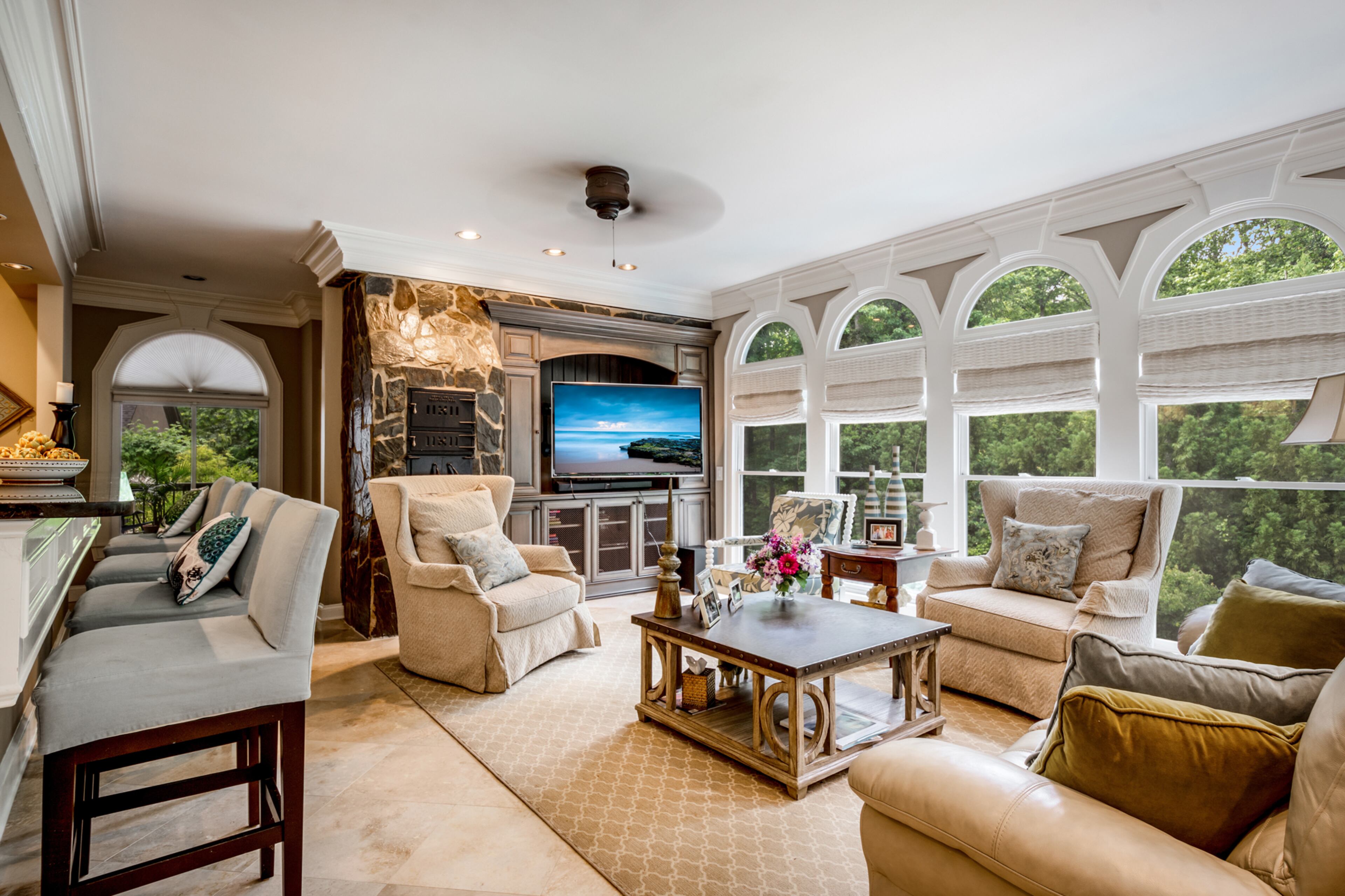 Large family room off kitchen with pizza oven.Text by Melanie White.