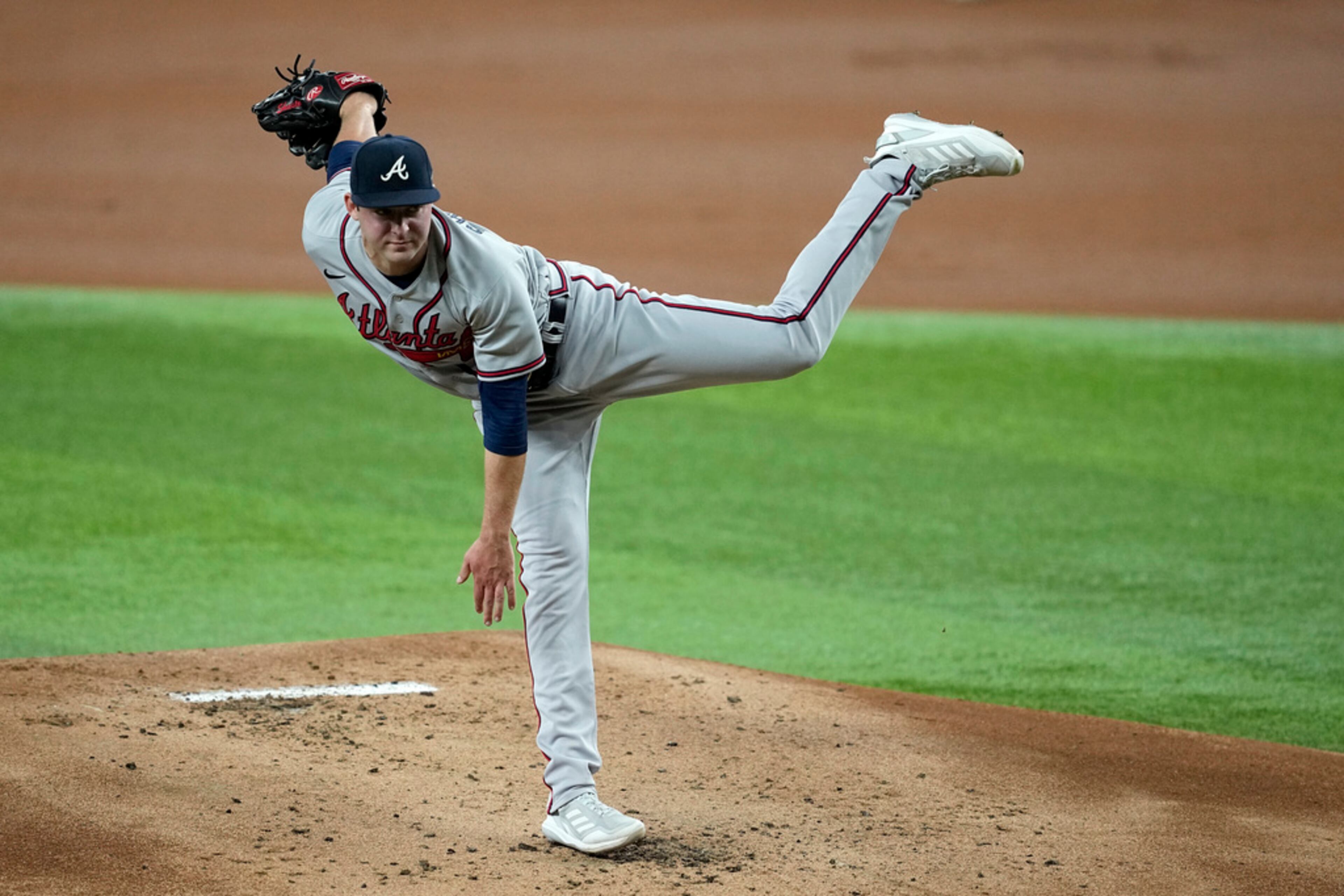 Atlanta Braves starting pitcher Jared Shuster follows throgh on his delivery to the Texas Rangers in the first inning of a baseball game, Tuesday, May 16, 2023, in Arlington, Texas. The Braves lost 7-4. (AP Photo/Tony Gutierrez)