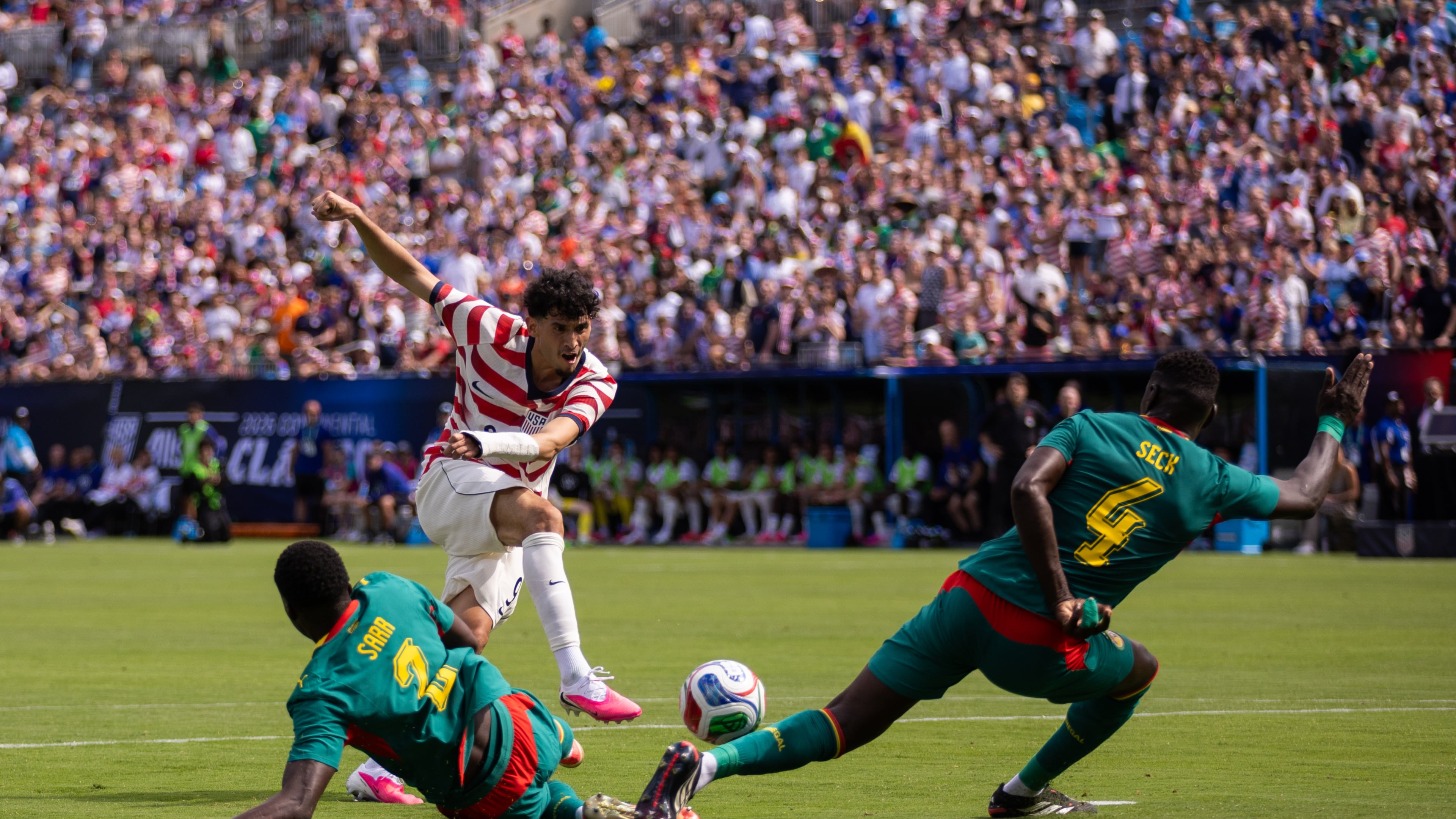 United States forward Ricardo Pepi, top left, has a shot blocked by Senegal defender Abdoulaye Seck (4) during the first half of an international friendly soccer match Sunday, May 31, 2026, in Charlotte, N.C. (AP Photo/Scott Kinser)
