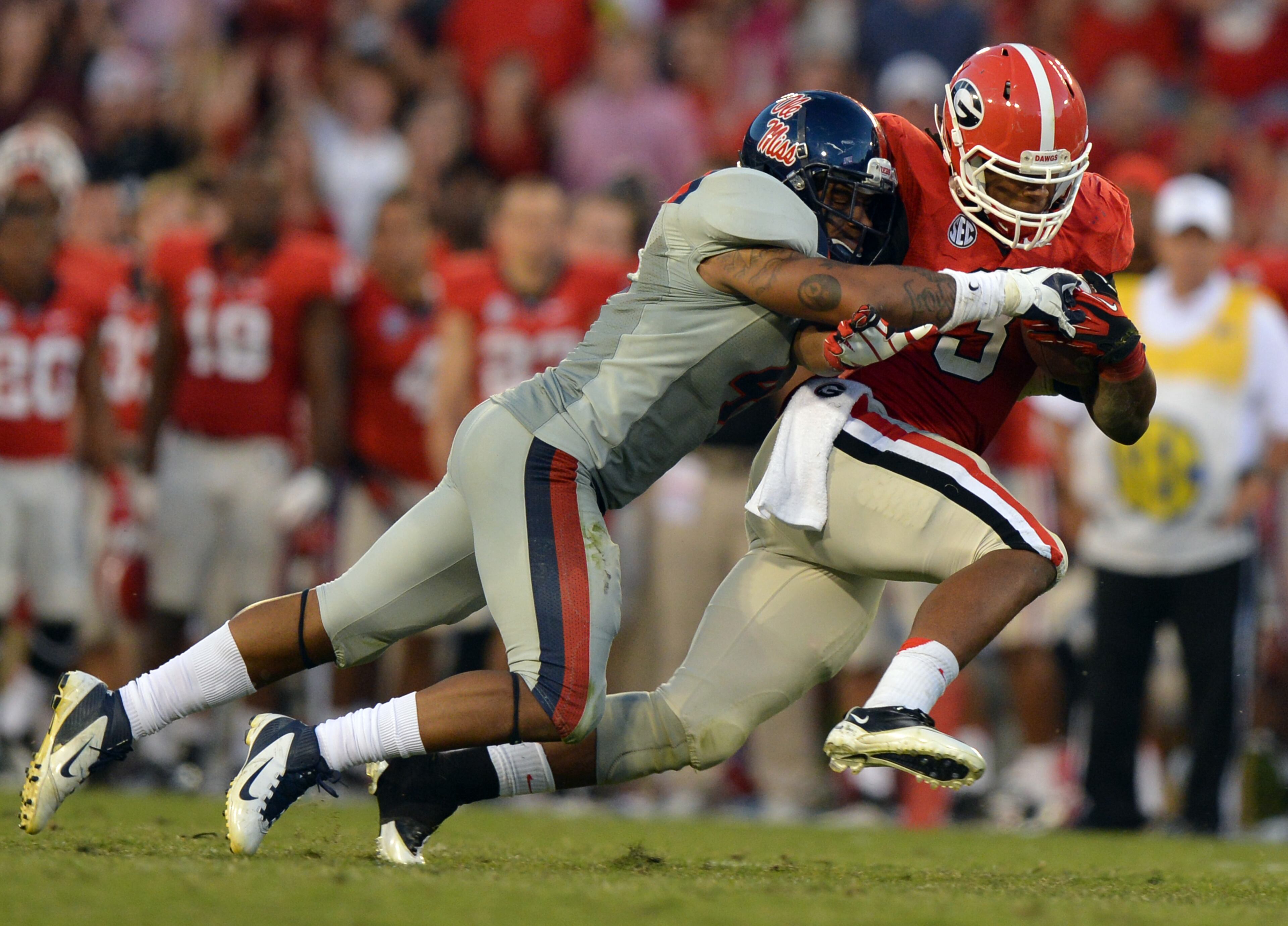 Mississippi linebacker Denzel Nkemdiche brings down Georgia's Todd Gurley. Denzel and incoming freshman Robert Nkemdiche could push Ole Miss back into the SEC's elite teams.