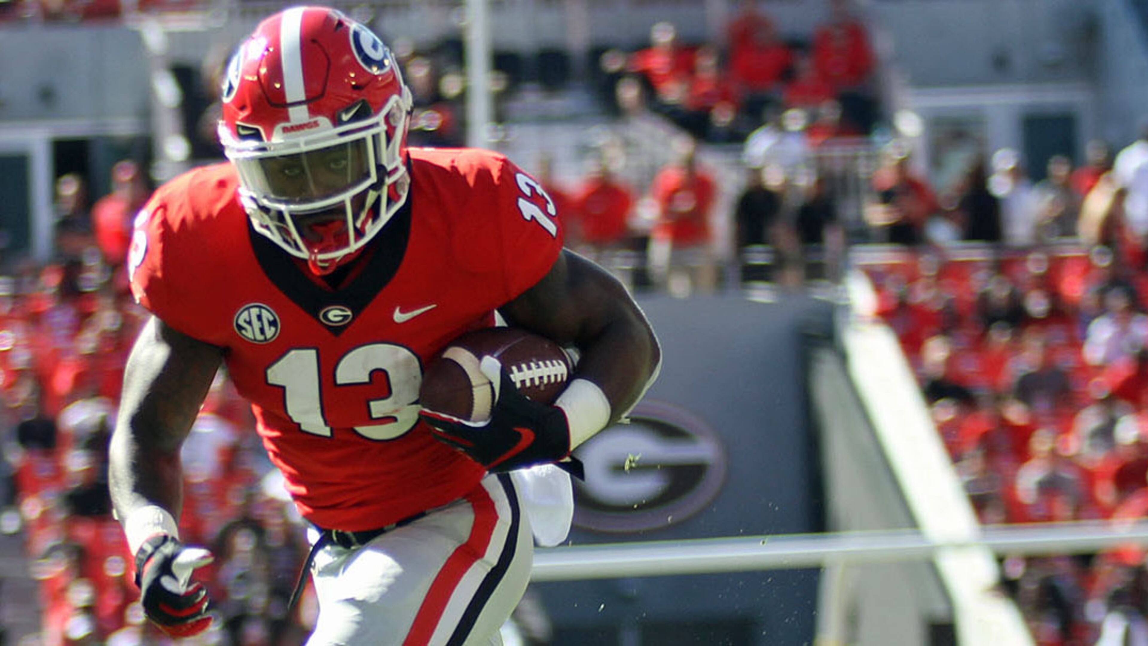 Georgia tailback Elijah Holyfield (13) scored on a 17-yard run against Austin Peay Saturday, Sept. 1, 2018, at Sanford Stadium in Athens.