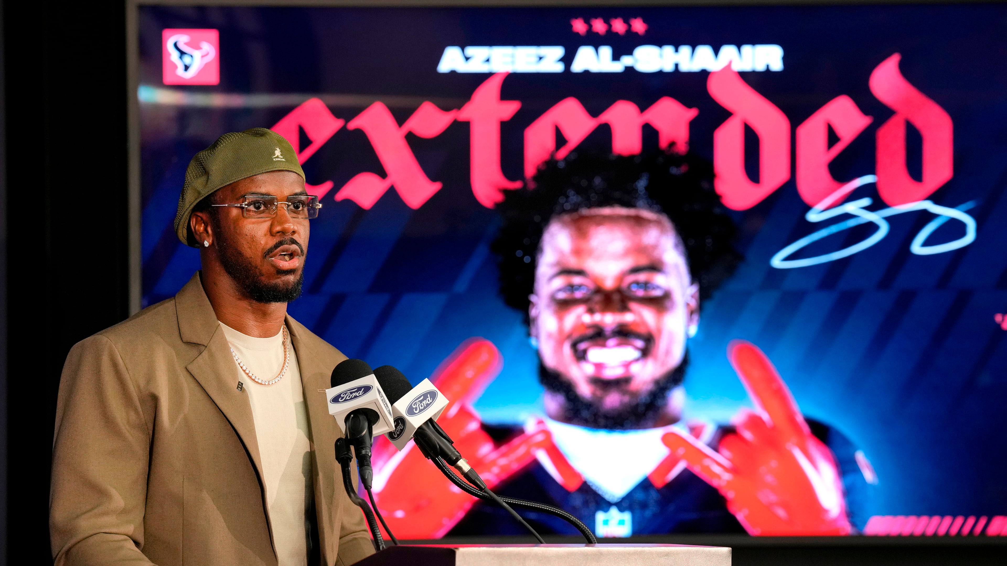 Houston Texans' Azeez Al-Shaair talks about his contract extension during a press conference at the NFL football team's facility, Friday, May 1, 2026, in Houston. (AP Photo/Karen Warren)