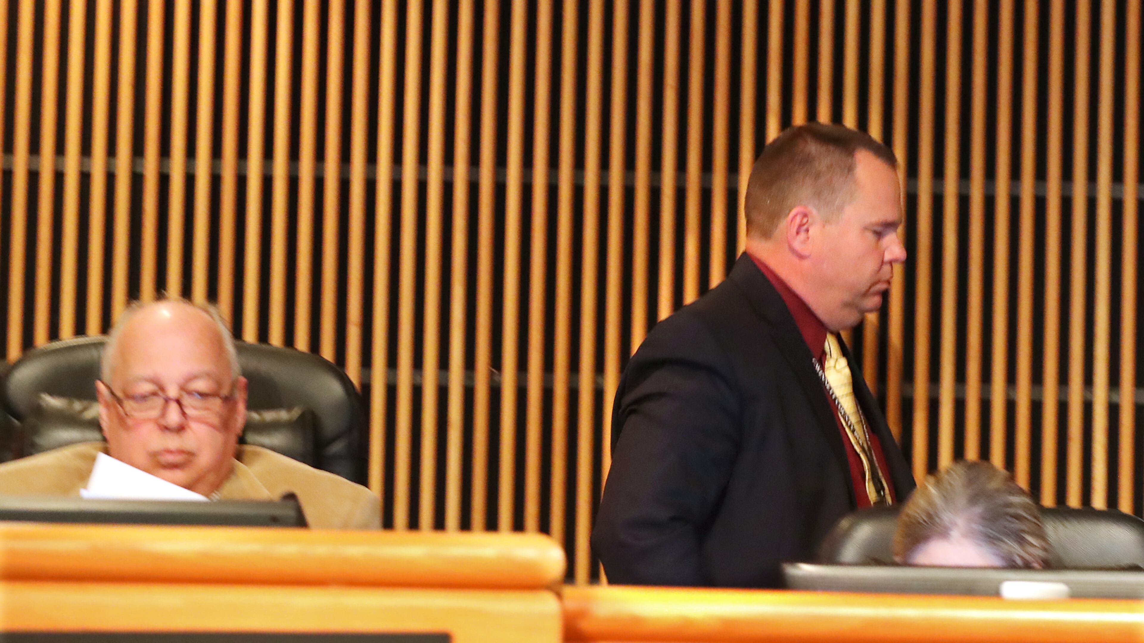 Tommy Hunter (right), the District 3 leader that recently called U.S. Rep. John Lewis a “racist pig” on Facebook, walks out just before public comments as more protesters demand his resignation during the Gwinnett County Board of Commissioners public hearing session on Tuesday Feb. 28, 2017, in Lawrenceville. Curtis compton/ccompton@ajc.com
