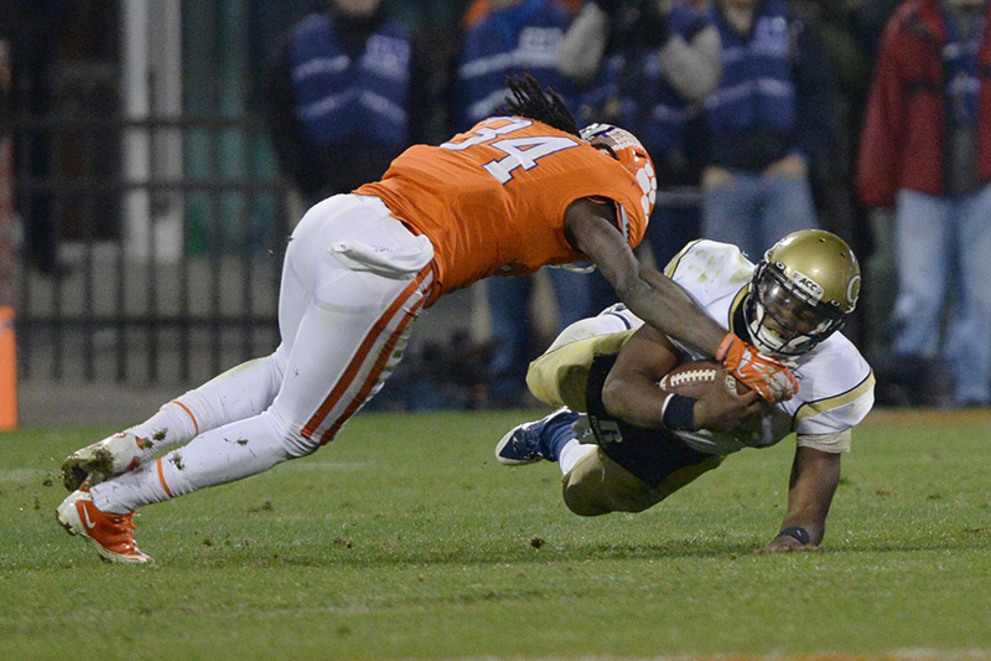 Georgia Tech quarterback Vad Lee (2) is tackled by Clemson's Quandon Christian. Lee was 13-for-23 passing for 165 yards and 1 interception. He also ran for 22 yards on 12 carries.