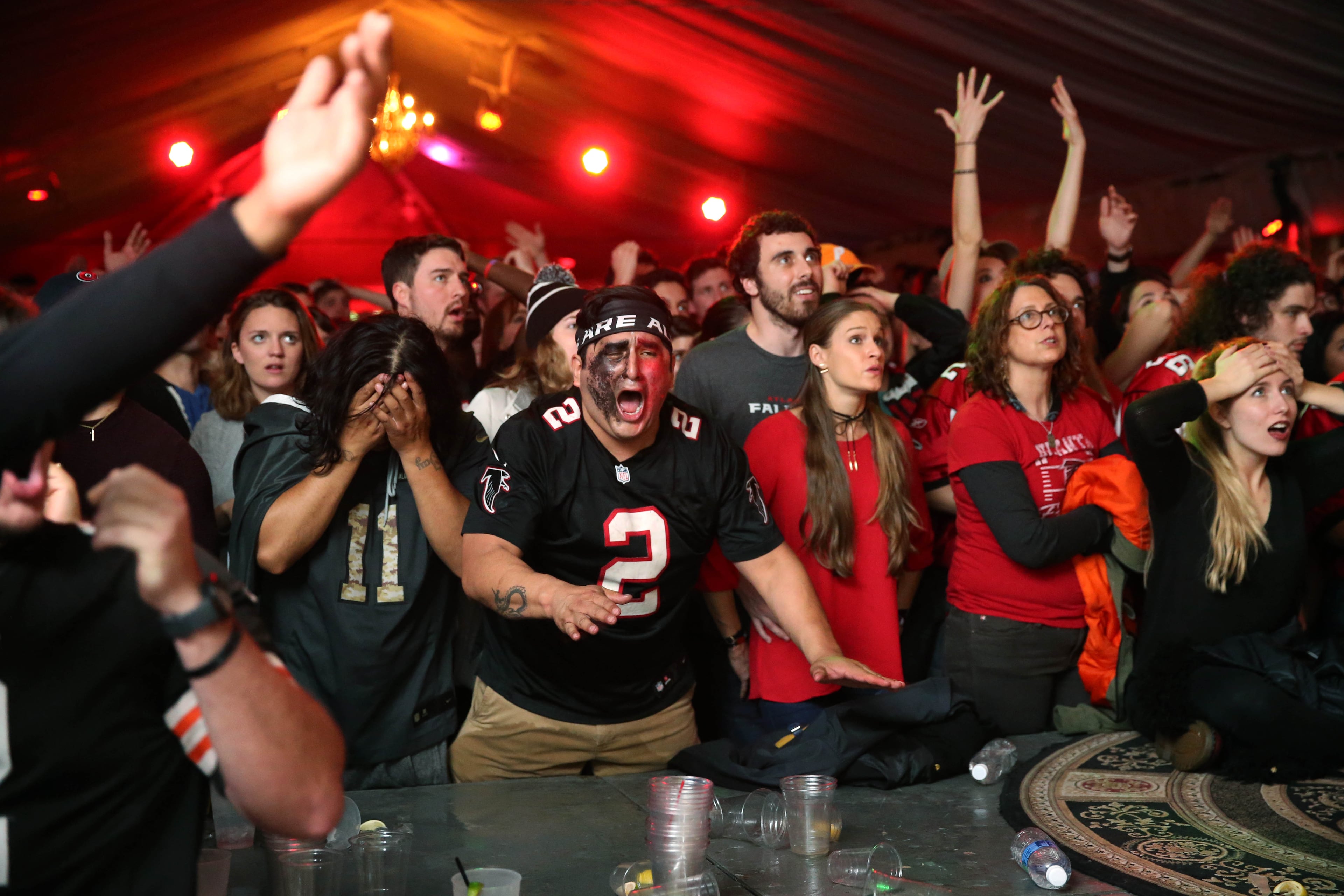 February 5, 2017 - Atlanta, Ga: Atlanta Falcons fans Jason Solis, left (11 jersey), and John Vergalejo (2) react to a play in the fourth quarter of Super Bowl 51 at Park Tavern Sunday February 5, 2017, in Atlanta. The Falcons lost to the Patriots 34-28 in overtime. PHOTO / JASON GETZ