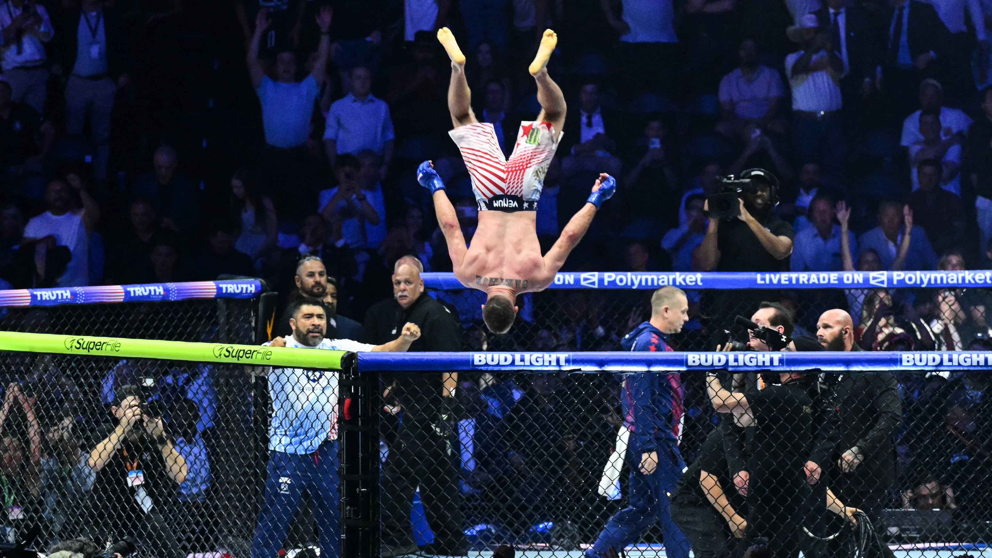 Justin Gaethje does a flip as he celebrates after defeating Ilia Topuria in a lightweight title bout during UFC Freedom 250 on the South Lawn of the White House, Monday, June 15, 2026, in Washington. (Saul Loeb/Pool Photo via AP)