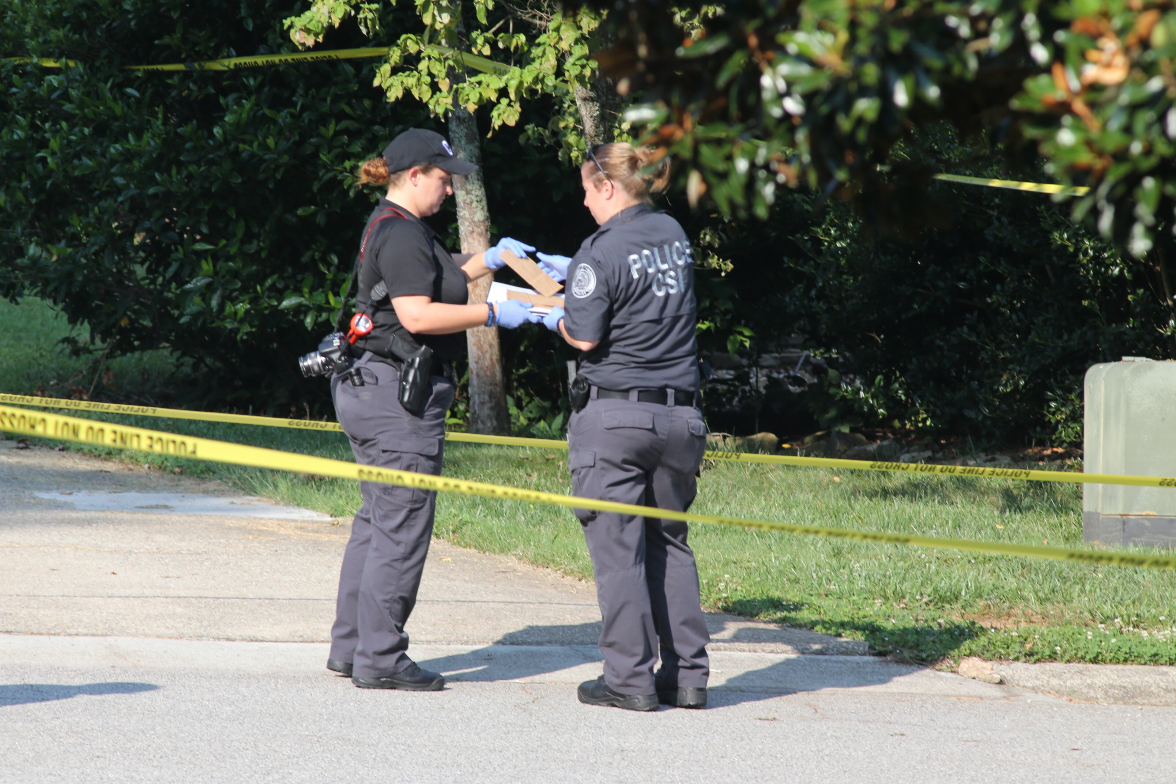 Duluth police are on the scene of a deadly home invasion in which a man was killed and a woman and child were shot and wounded. JOHN SPINK/JSPINK@AJC.COM