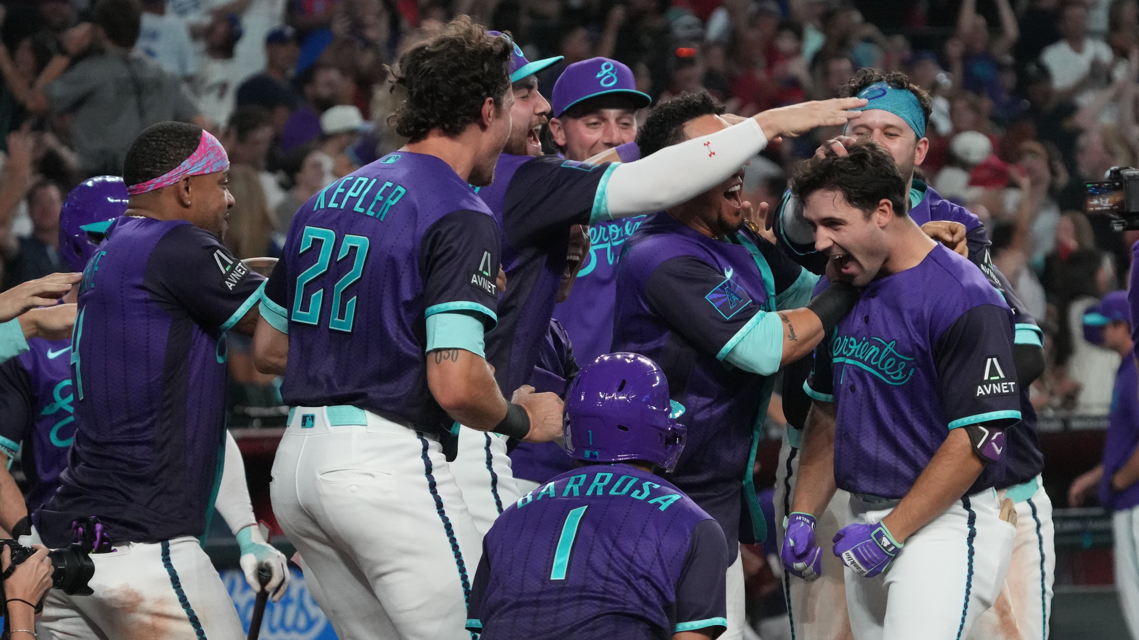 Arizona Diamondbacks' Ryan Waldschmidt celebrates with teammates after hitting a two-run walk off home run against the Los Angeles Dodgers during a baseball game, Friday, Aug 7, 2026, in Phoenix. (AP Photo/Rick Scuteri)