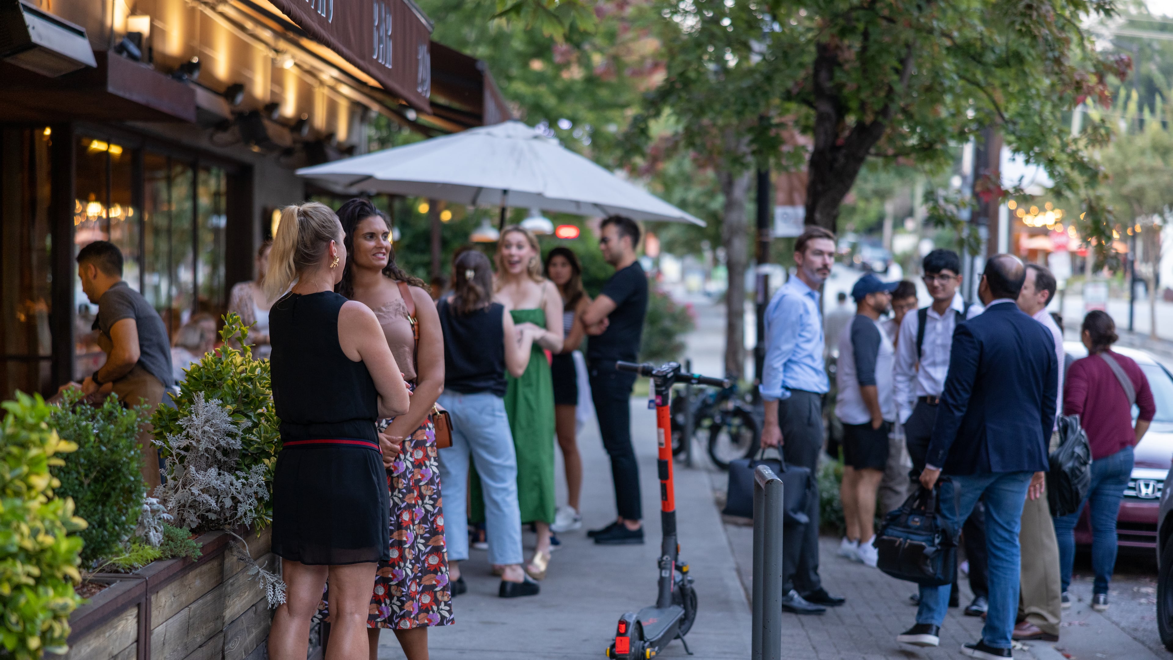 People talking in front of Barcelona Wine Bar at Inman Park on September 19, 2022