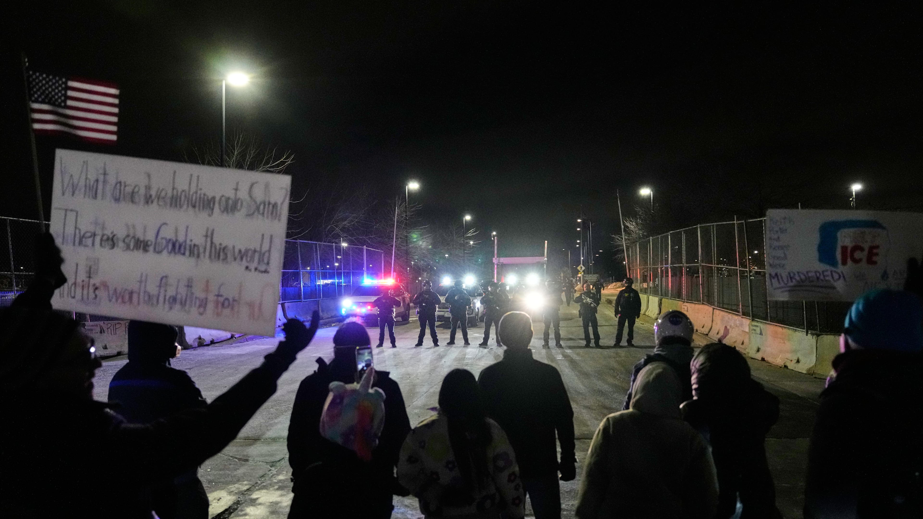 FILE - Federal immigration officers confront protesters outside Bishop Henry Whipple Federal Building in Minneapolis, on Thursday, Jan. 15, 2026. (AP Photo/Yuki Iwamura, File)